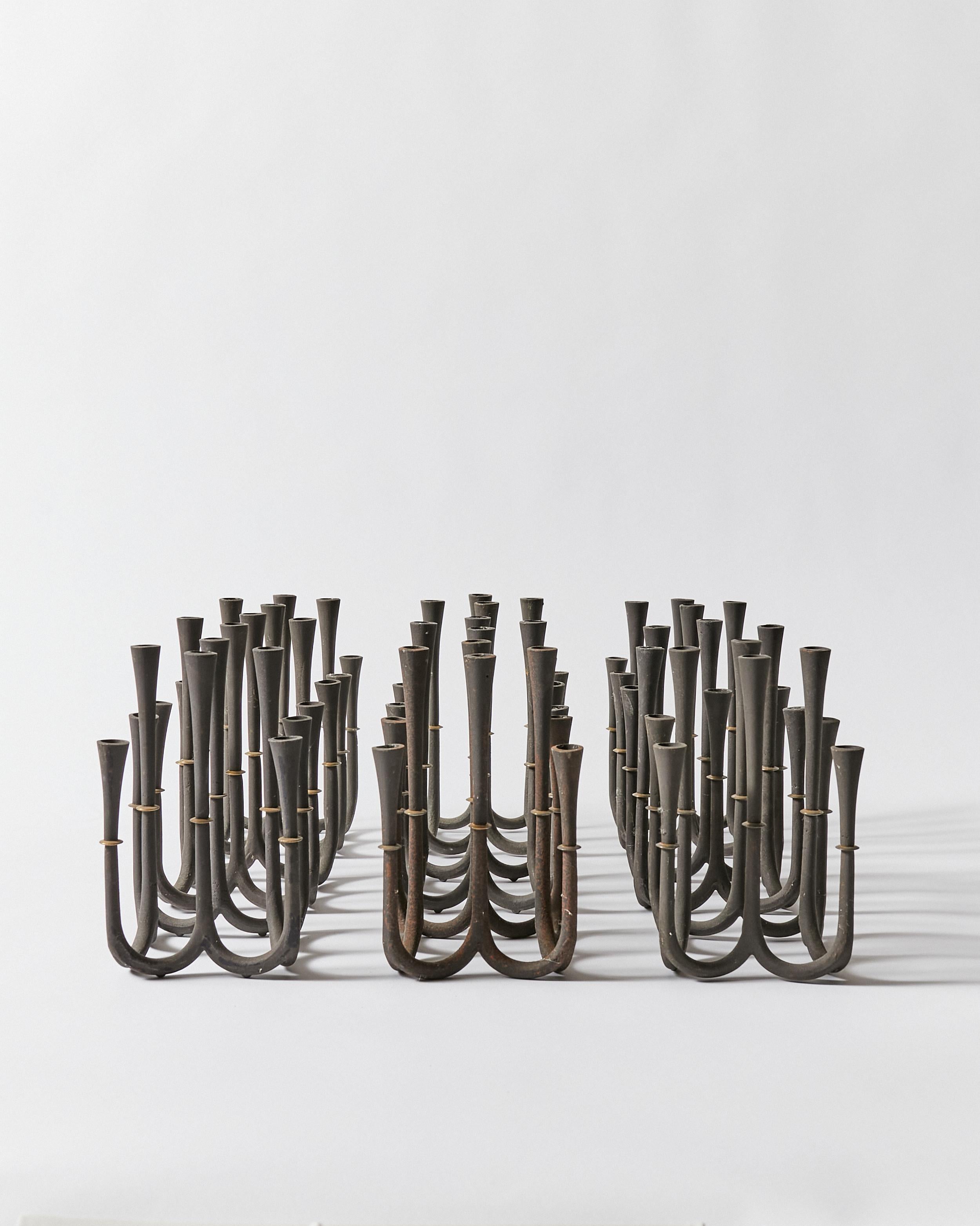 Set of nine candle holders by Jens Harald Quistgaard for Dansk Designs, Denmark.