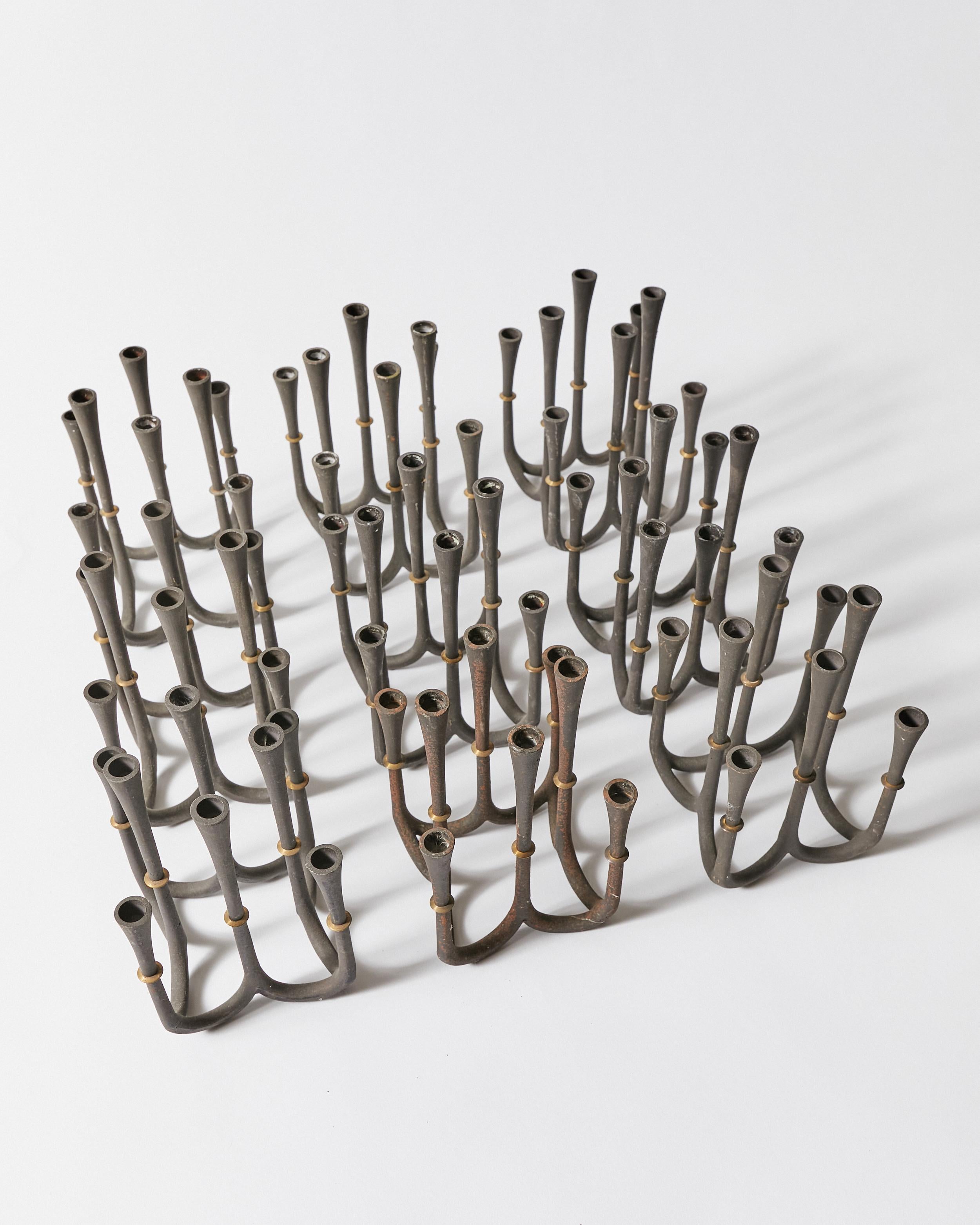 Mid-Century Modern Set of Nine Candle Holders by Jens H. Quistgaard for Dansk Designs For Sale