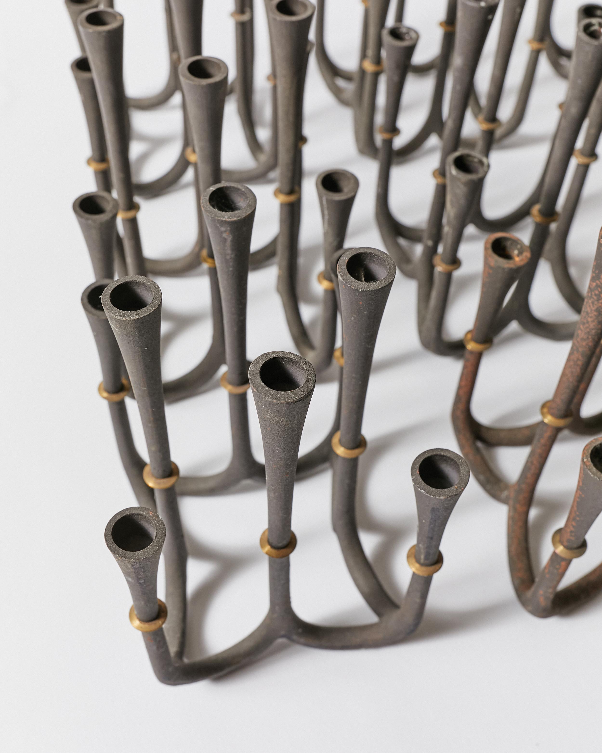 Metal Set of Nine Candle Holders by Jens H. Quistgaard for Dansk Designs For Sale