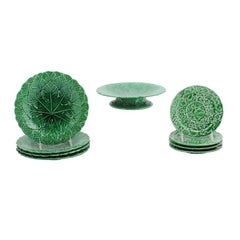 Set of Nine Green Glazed Porcelain Pieces with Eight Plates and Single Compote