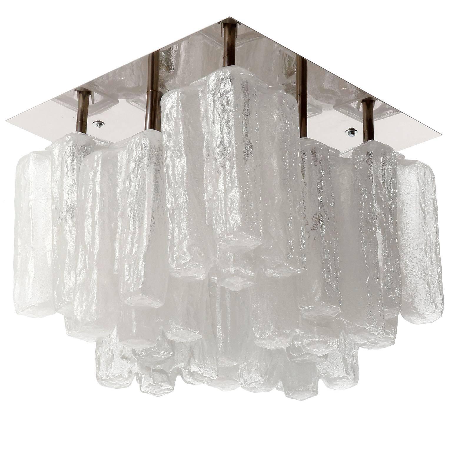One of eight square light fixtures by Kalmar, Austria, manufactured in midcentury, circa 1970 (late 1960s or early 1970s). 
Each fixture has eight sockets for small screw base bulbs E14 (e.g. LED or filament, max. 40 W per bulb) which are covered