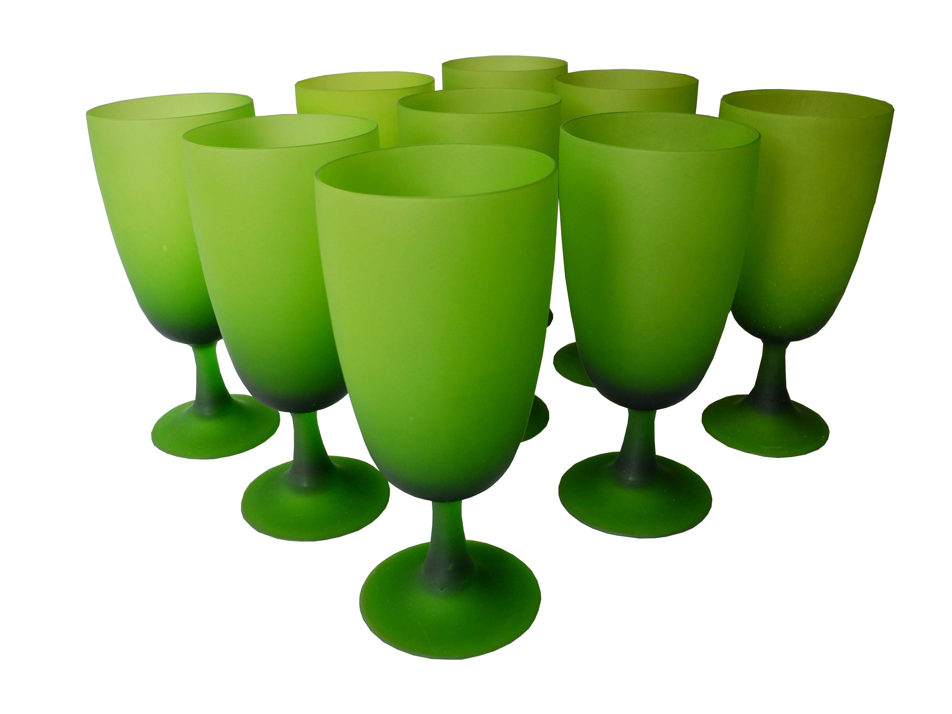 This midcentury set of nine dinner glassed come from Italy. Softly frosted green, they are stemmed.