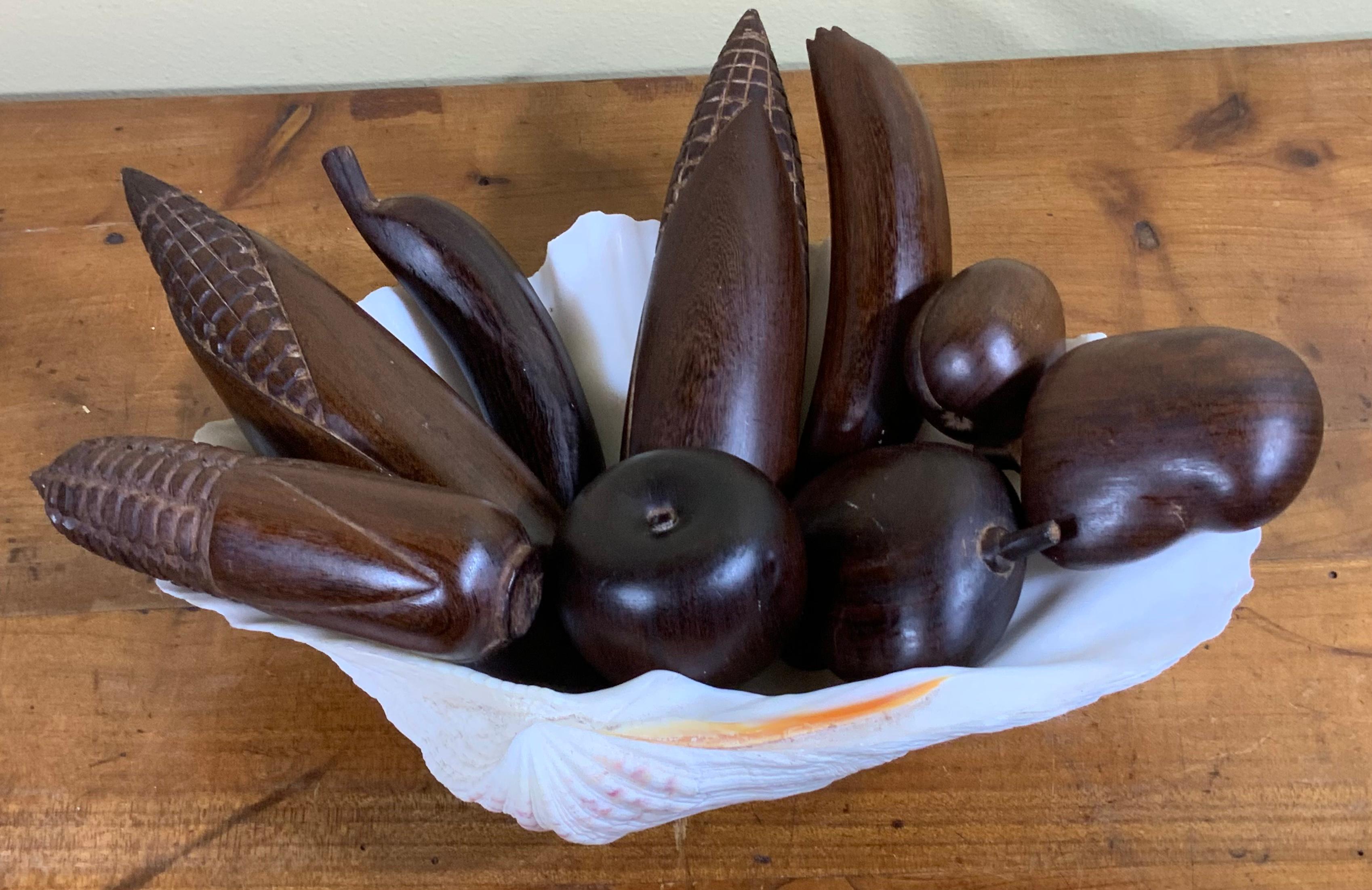 Beautifully carved set of nine pieces hand carving solid wood fruit, corn mango banana apples and small prune, shell is not included.
Approximately sizes :
Banana 7” long 
Corn 9” x 2”.5
Baby corn 6”
Mango 3”.5 x 3”
Apple 2”.5 x 2”
Prune 2”.5