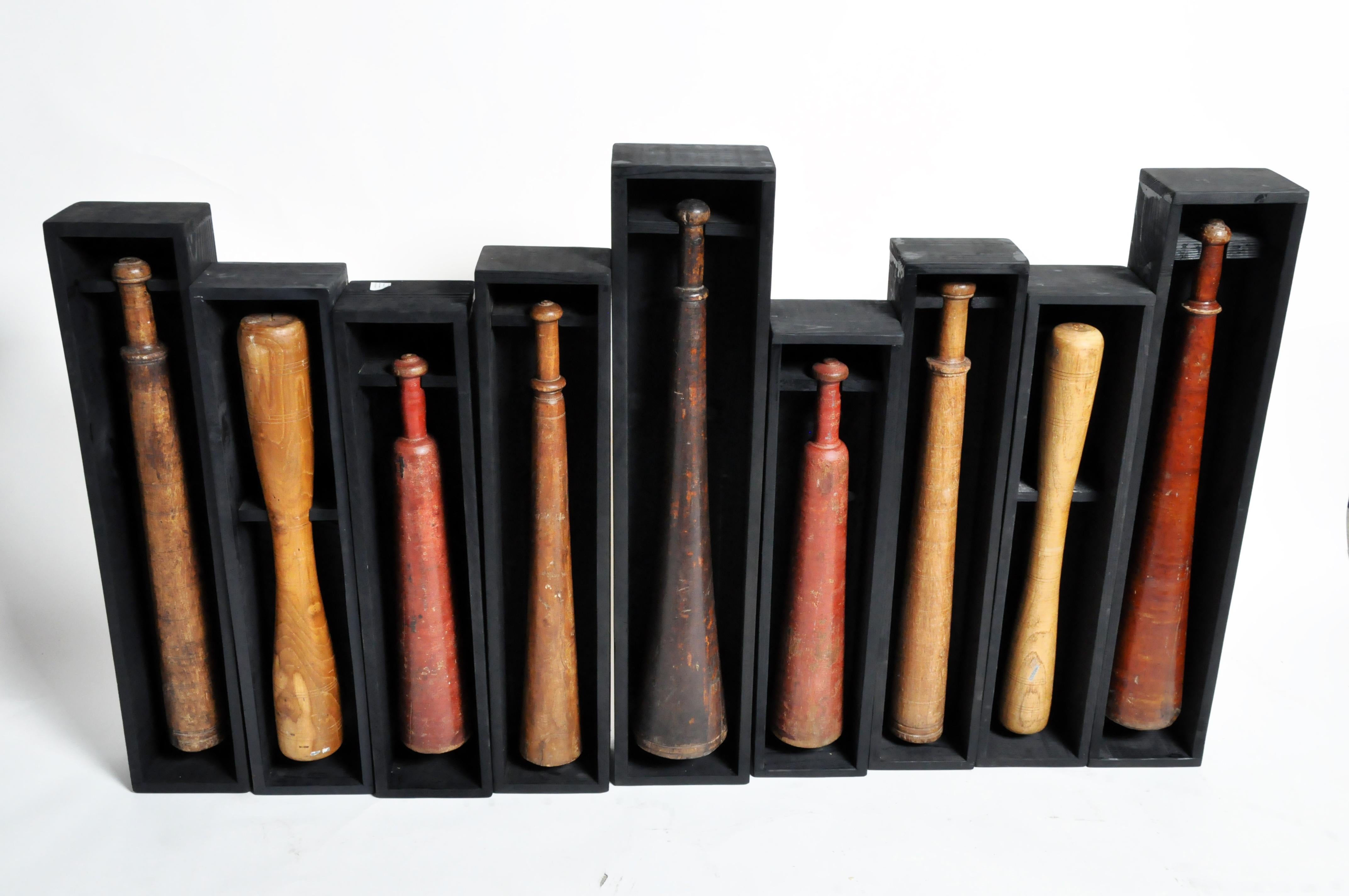 Indian Set of Nine Wooden Exercise Bats Mounted in Wooden Trays