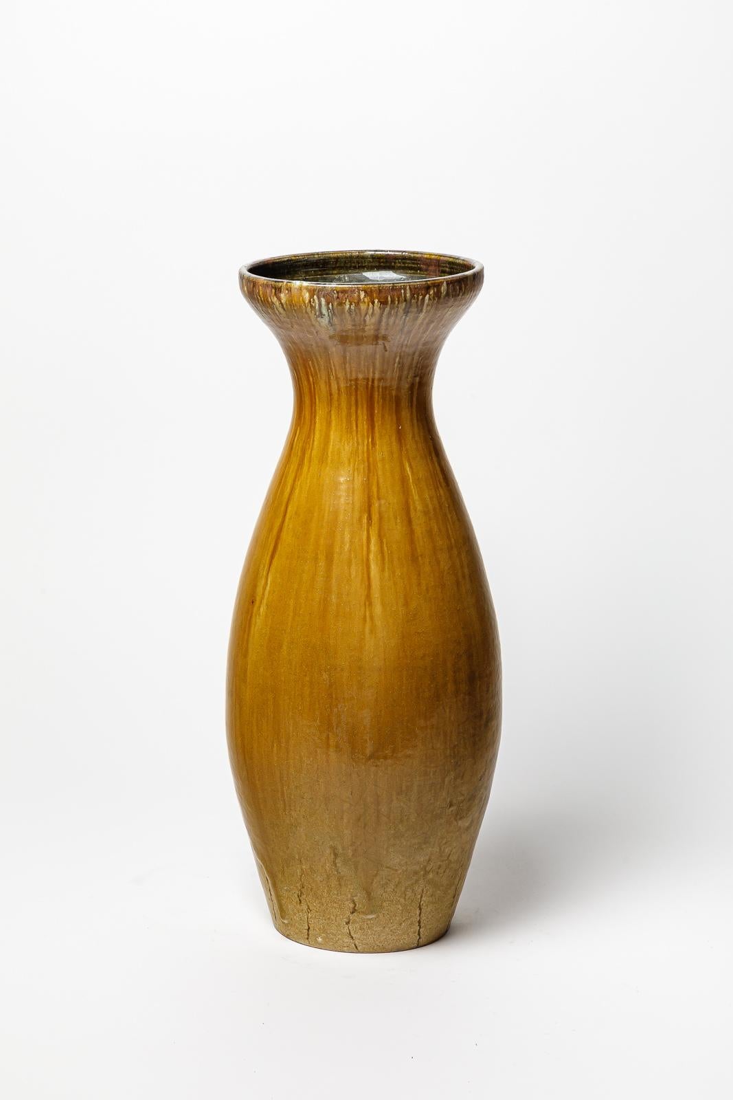 Set of ocher, brown and white glazed stoneware vases by Accolay. 
Artist signature under the base. Circa 1960-1970.
H : 17.7’ x 6.3’ inches / H : 21.6’ x 8.3’ inches / H : 18.9’ x 7.1’ inches.