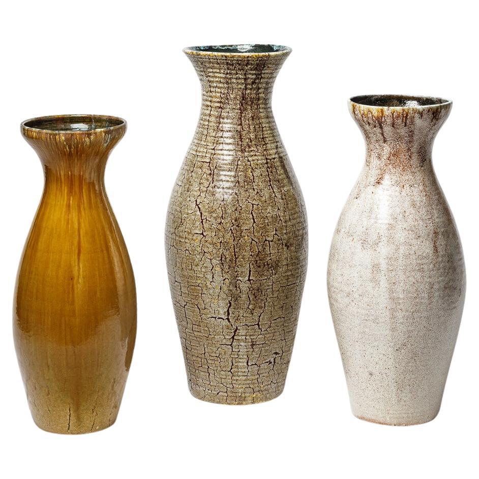 Set of ocher, brown and white glazed stoneware vases by Accolay, circa 1960-70. For Sale