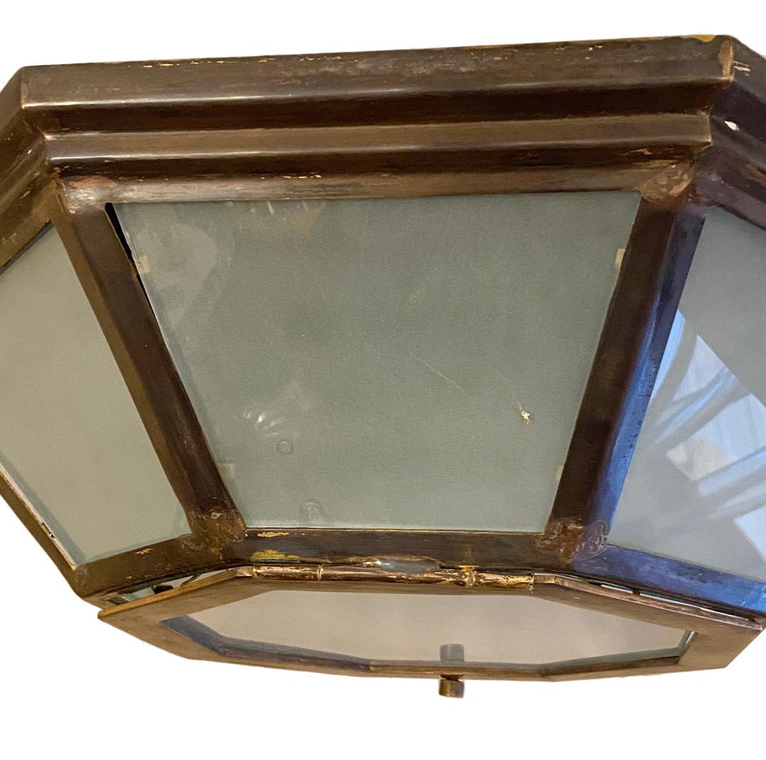 Set of eight Italian bronze light fixtures with 4 interior candelabra lights original patina and frosted glass insets. Sold individually.

Measurements:
Height: 6