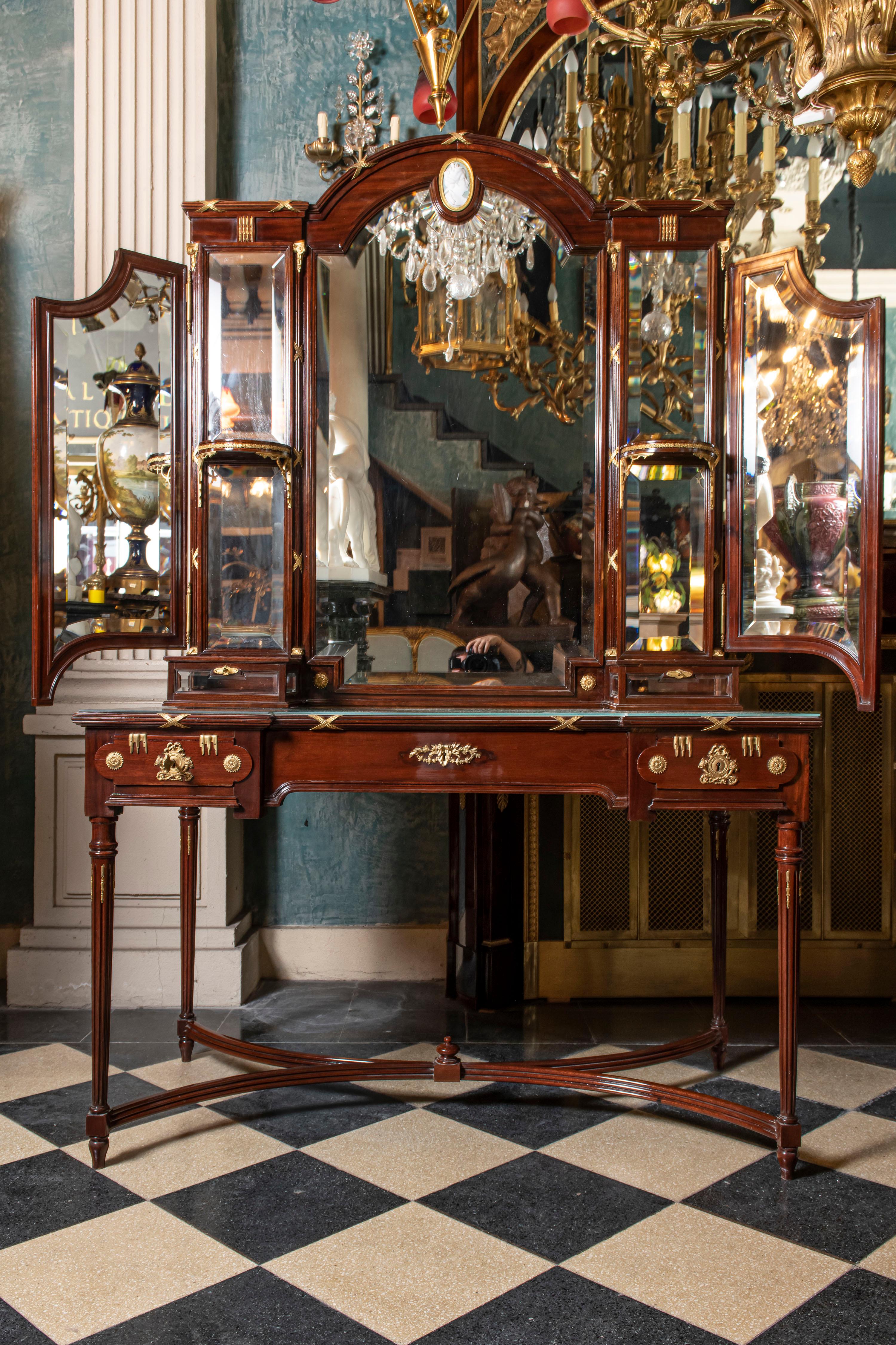 Set of one vanity desk, one chair, two nightstands and one wardrobe in gilt bronze, marble, porcelain and wood. France, late 19th century.

Dimensions of the vanity desk: 203 cm height, 185 cm width, 65 cm depth.
Dimensions of the chair: 90 cm