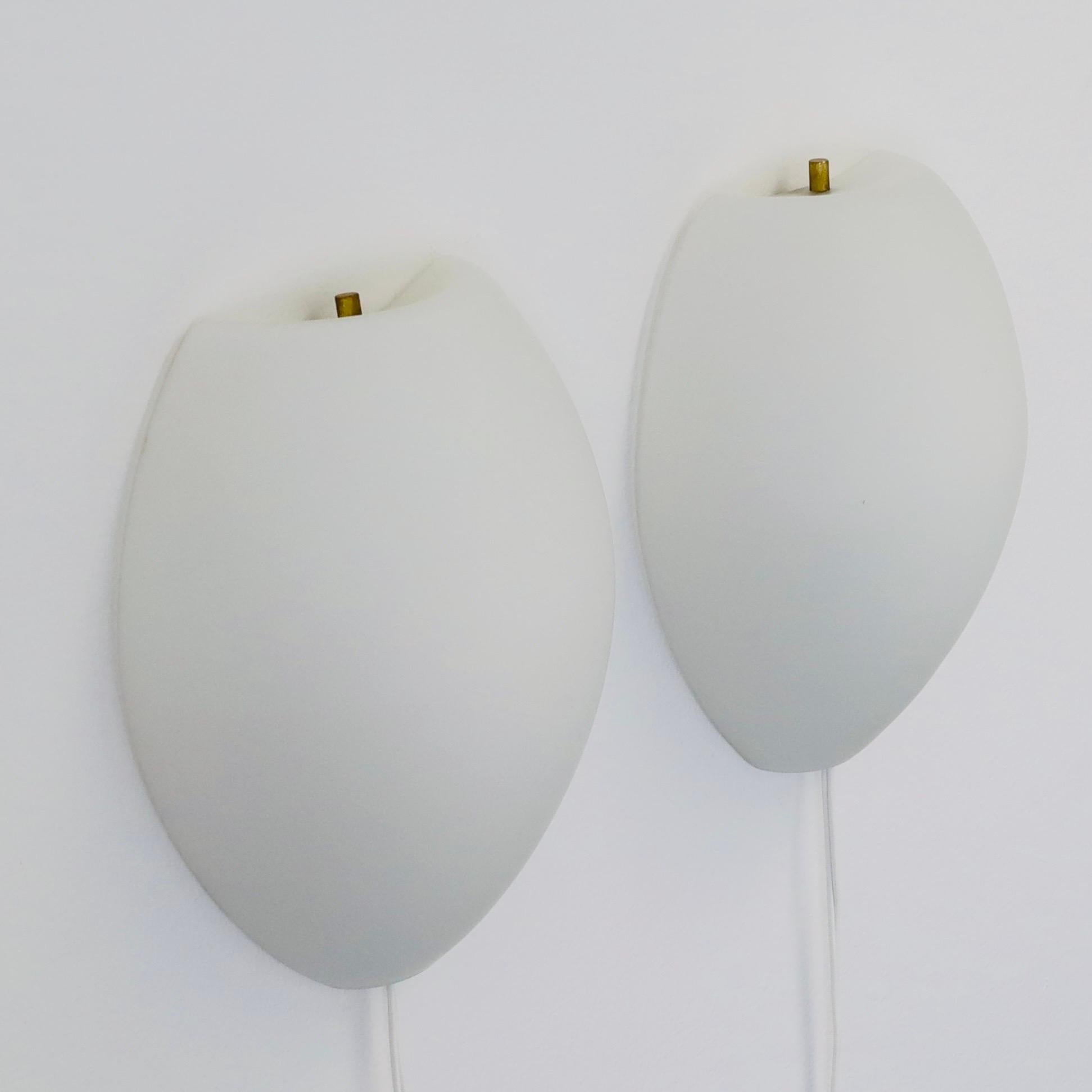 Extremely rare set of opaline glass sconces by Jo Hammerborg for Fog & Mørup. A Nordic touch to beautiful home. 

* A set (2) of wall lamps with white mouth-blown opaline glass shades. 
* Designer: Jo Hammerborg 
* Model: Vasa
* Producer: Fog &