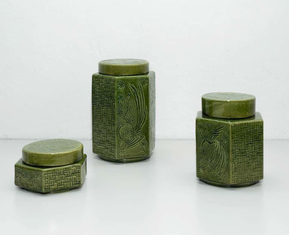 Set of green oriental ceramic vases, circa 1960.

In original condition, with minor wear consistent of age and use, preserving a beautiul patina.

Dimensions:
H 19.5 H 15 H 6.5
W 11.5 W 11.5 W 11.5
D 11.5 D 11.5 D 11.5.
   