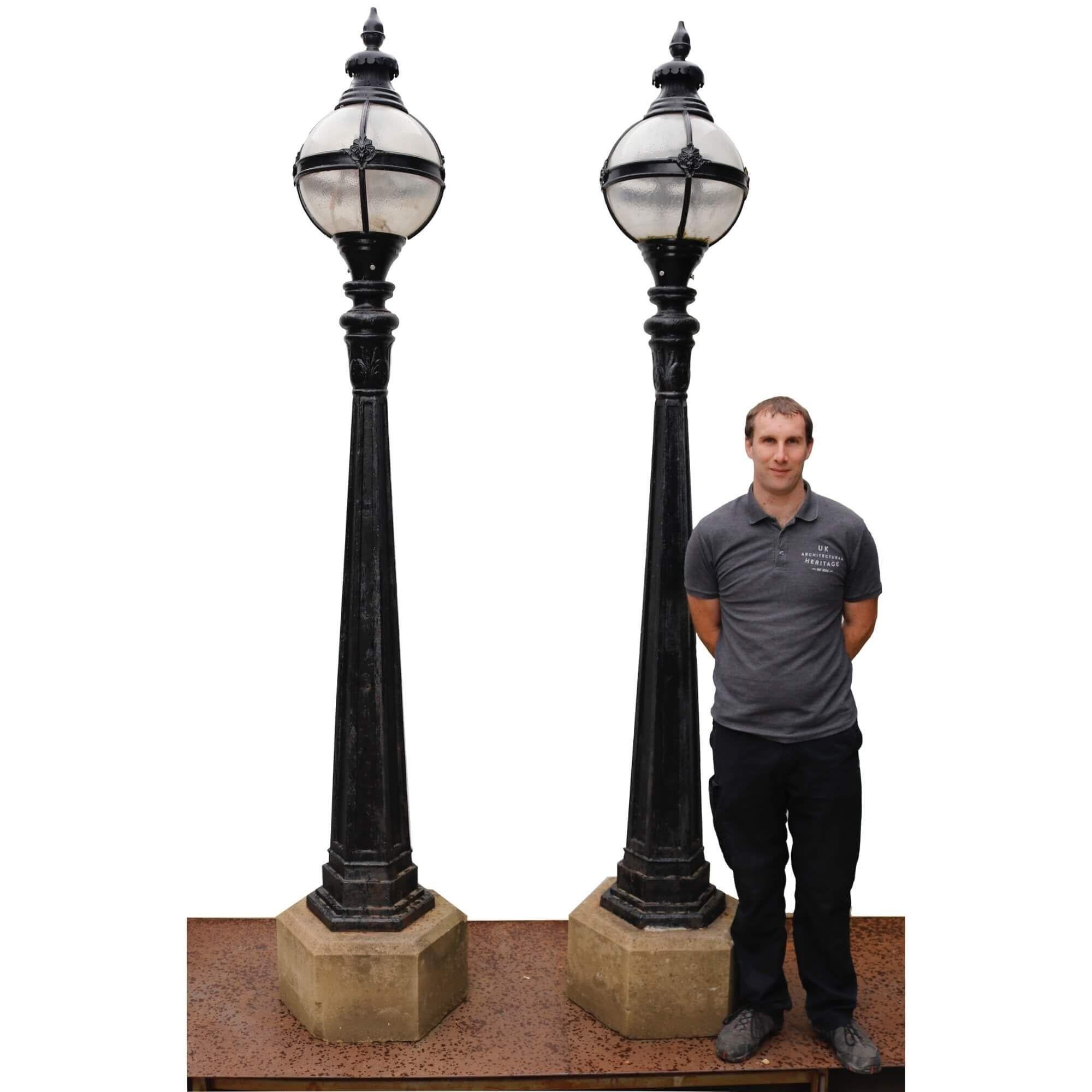 A tall set of original antique Victorian lamp posts, reclaimed from Moorlands House, Birdcage Lane, Savile Park, Halifax.

Each comprises of a late 19th century cast iron post, set into a hexagonal York stone base, with a later 20th century