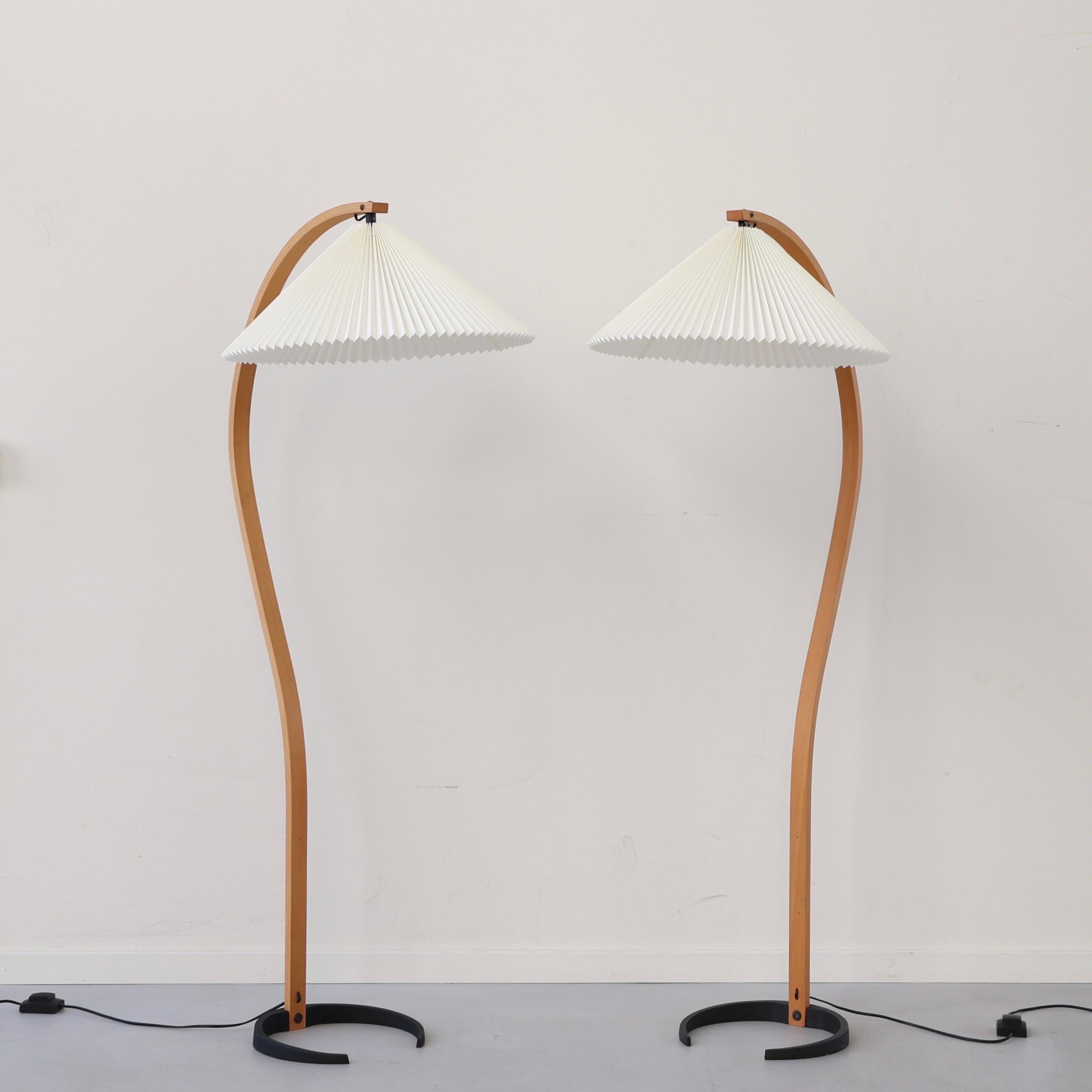 Set of Striking Timberline no. 840 Floor Lamps designed by Mads Caprani in the 1970s.  

* A set (2) of bend beech veneer floor lamps with egg-white fabric shades
* Model: 840
* Manufacturer: Caprani Light A/S Denmark 
* Year: 1980s
* Condition:
