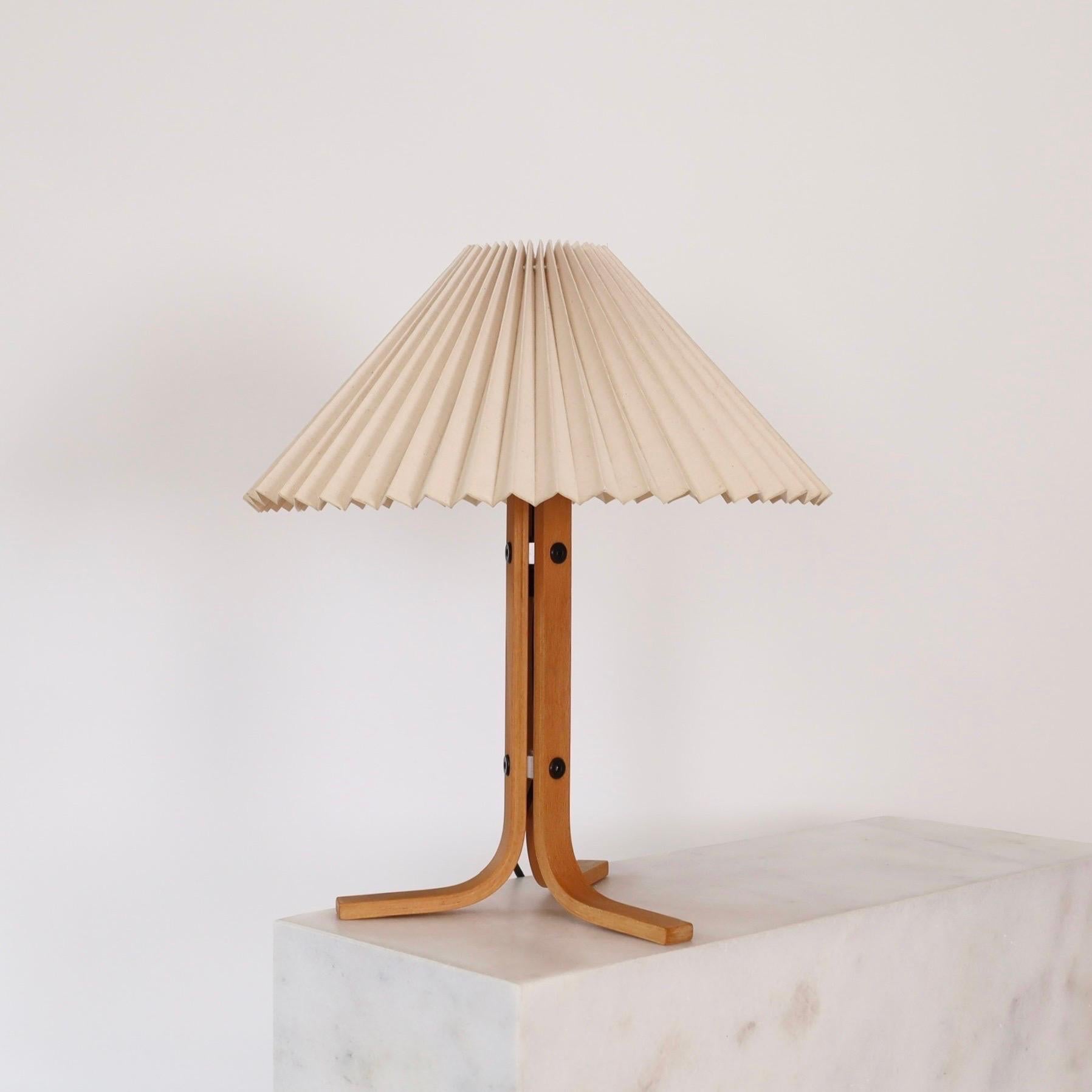 Set of Beech Wood Tripod Desk Lamps designed by Mads Caprani in the 1970s. A rare find for a beautiful home.

* A set (2) of tripod desk lamps in bend beech veneer with a pleated light-beige fabric shades
* Designer: Mads Caprani
* Model: 223
*