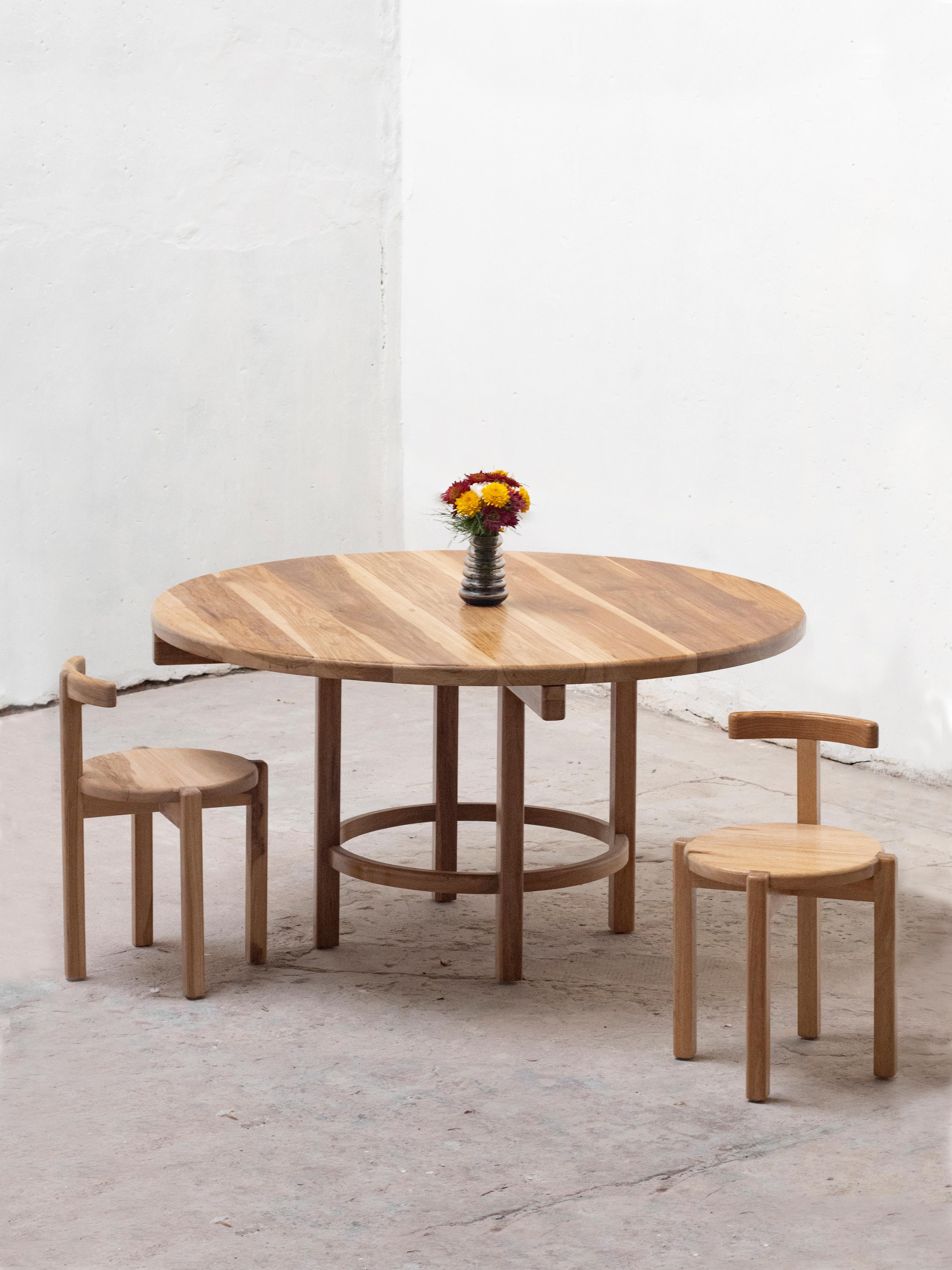 A set of orno round dining table & 2 chairs by Ries
Dimensions: D120 x H73 cm (table)
D44 x H63 cm (chair)
Materials: Hardwood
Transparent matte lacquer, color matte lacquer (Finishings)

Ries is a design studio based in Buenos Aires,