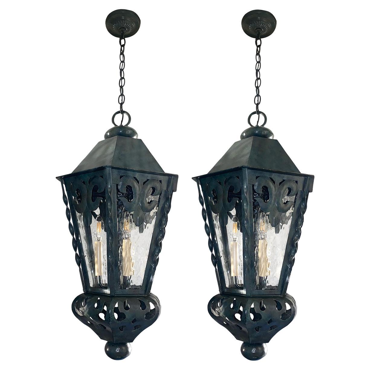 A set of four circa 1920's English metal lanterns with verdigris patina. Sold individually.

Measurements:
Minimum drop: 32