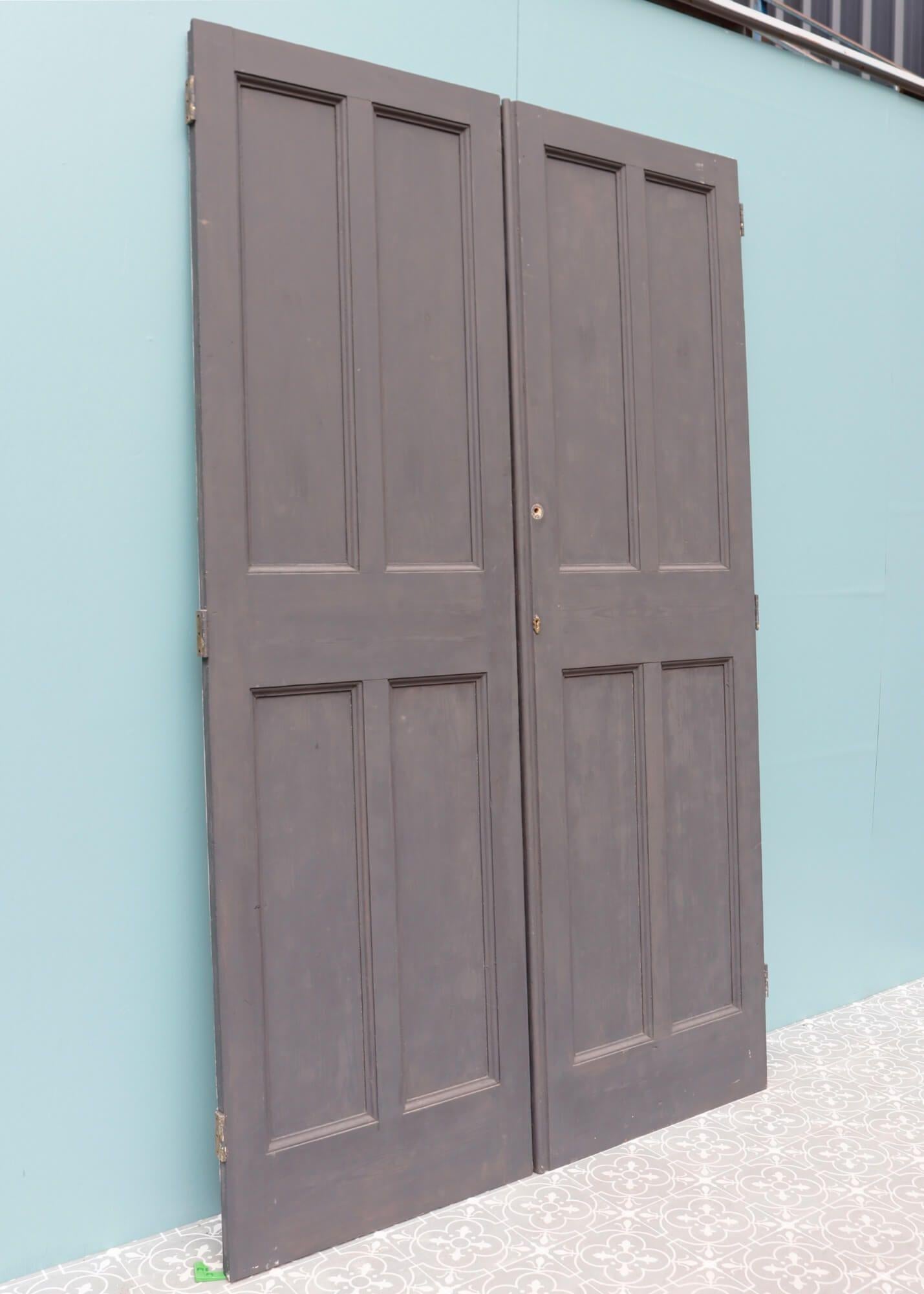 These tall, reclaimed cupboard doors came from a large Victorian townhouse in the idyllic Herefordshire market town of Bromyard. Dating from the 1870s, these handsome pine cupboard doors are dual tone, painted with grey primer to the front and white