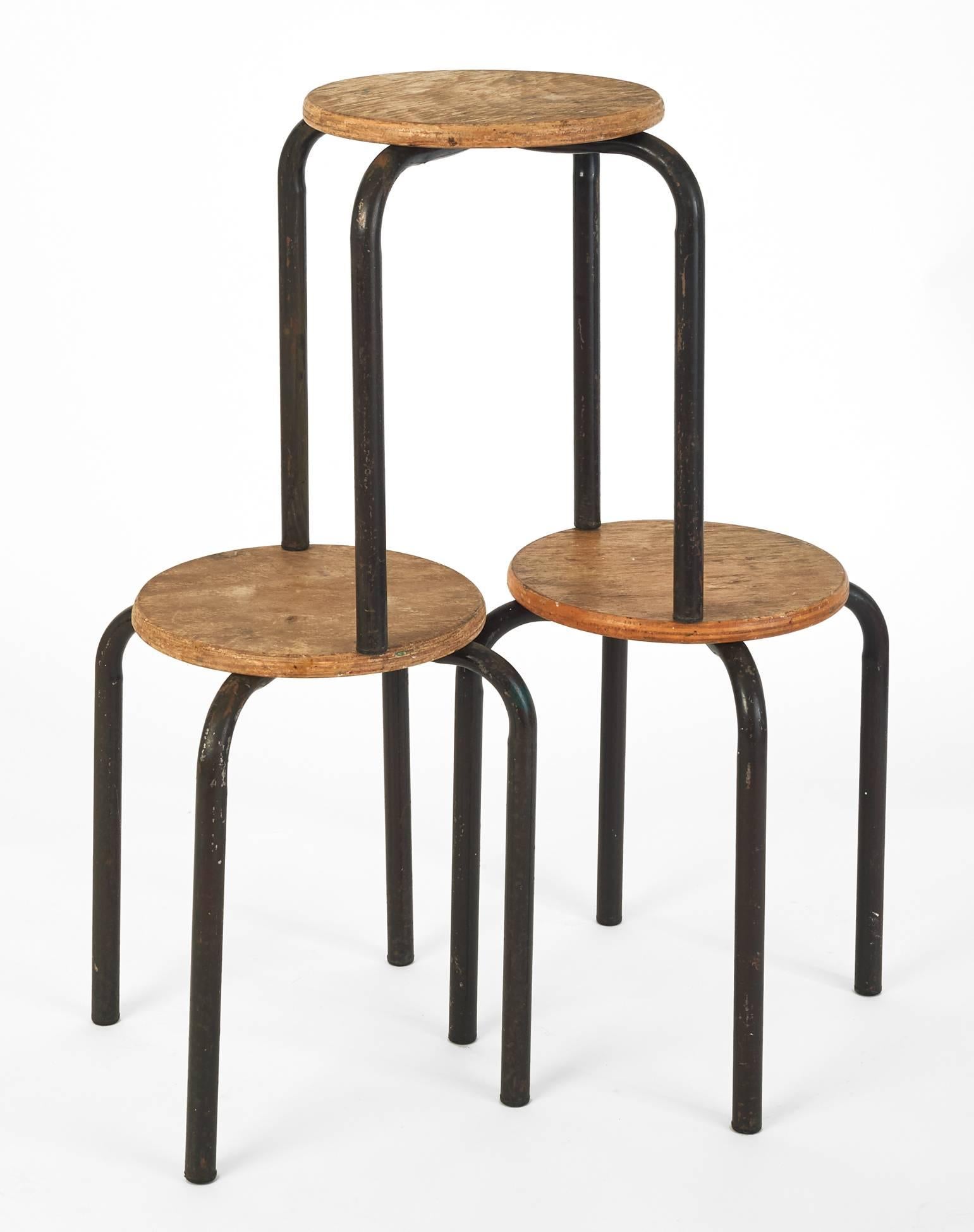 France, 1950's 

A whimsical set of three stackable painter stools in the style of Jean Prouvé, their utilitarian laminated wood seats and lacquered metal bases a model of functional design.
  