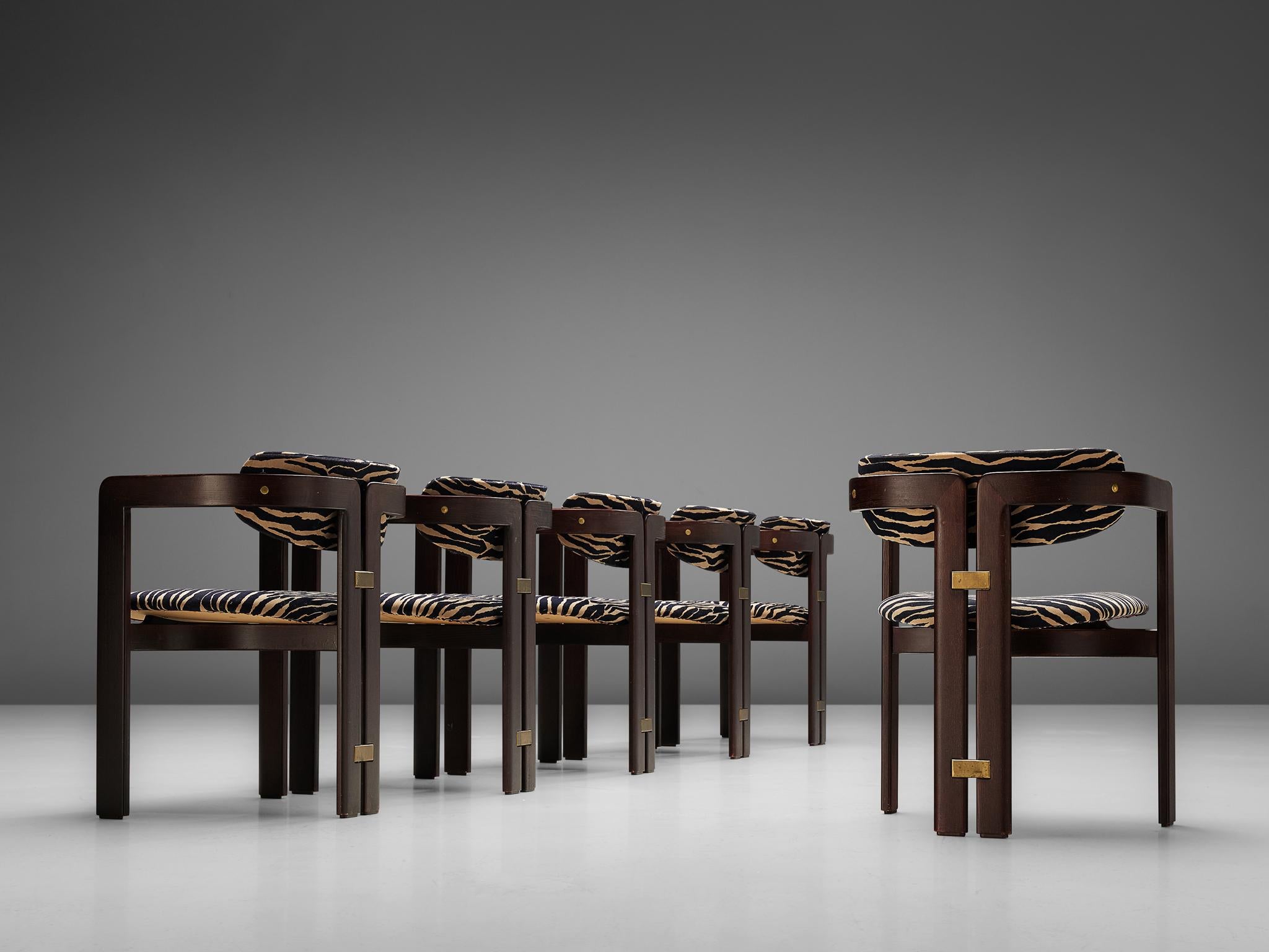 Augusto Savini for Pozzi, set of six 'Pamplona' dining room chairs, ebonized ashwood, zebra print upholstery, and brass, Italy, 1965.

Set of six armchairs in black lacquered ash and fabric upholstery. A characteristic design; simplistic yet very