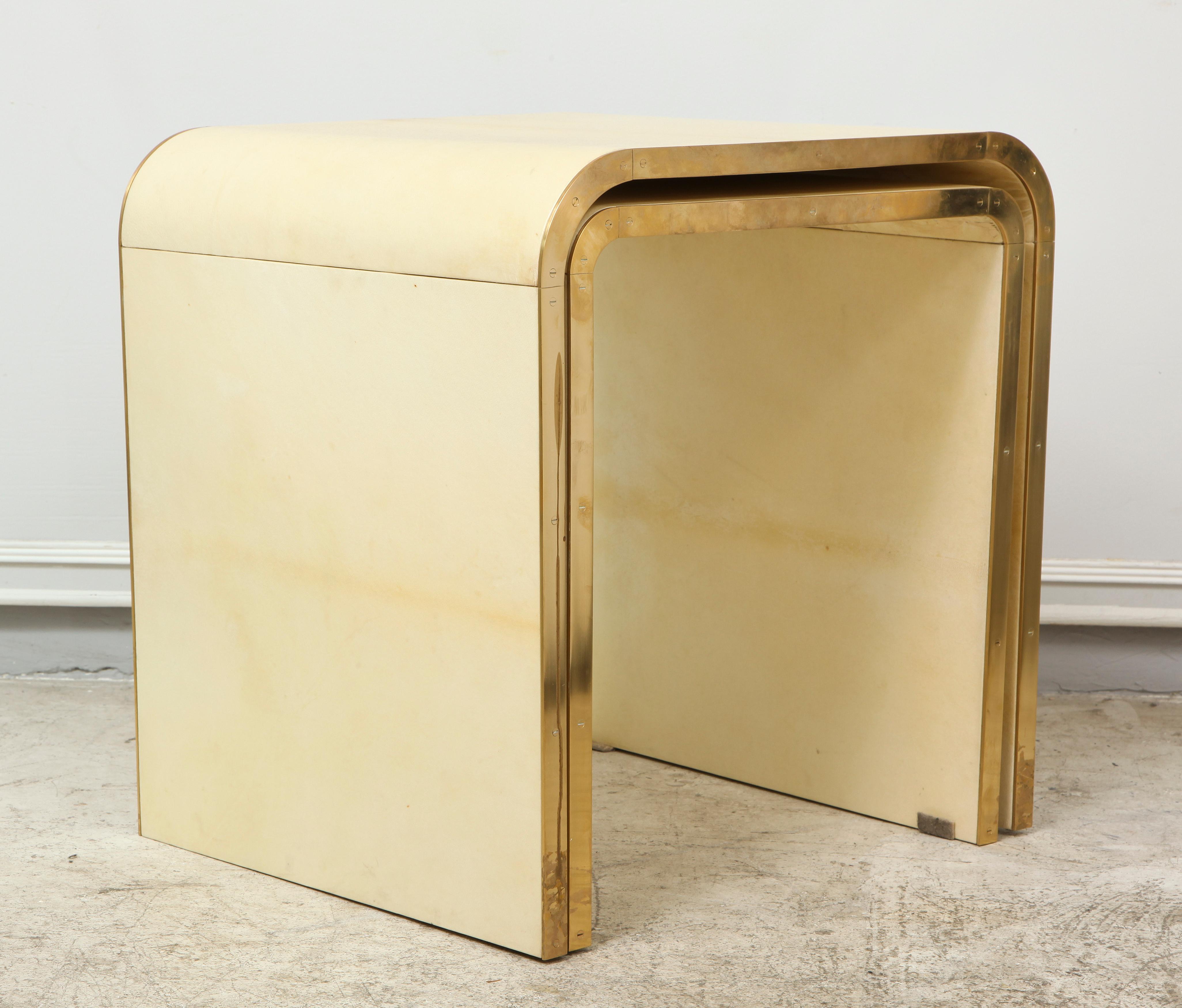 A set of 2 custom parchment nesting tables with bronze banding in the Jean Michel Frank manner, can be custom made with a lead time of 8-10 weeks.

The taller table measures: H 19.5