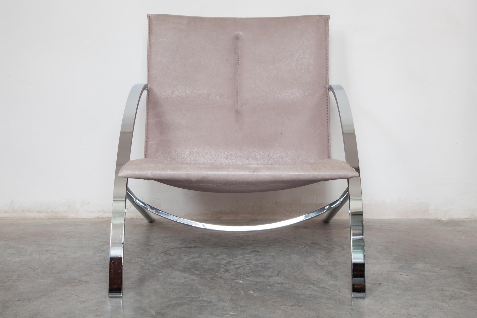 Leather loungers, Switzerland
Vintage leather loungers by Paul Tuttle, Model Arco, 1976.
Switzerland. Polished chrome-based with beautiful arched armrests. Grey leather sling seat with aged patina. No rips or tears.

Dimensions: 68 W x 75 H x 86 D