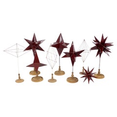 Set of pedagogical models of polygonal shapes in red lacquered zinc with wood