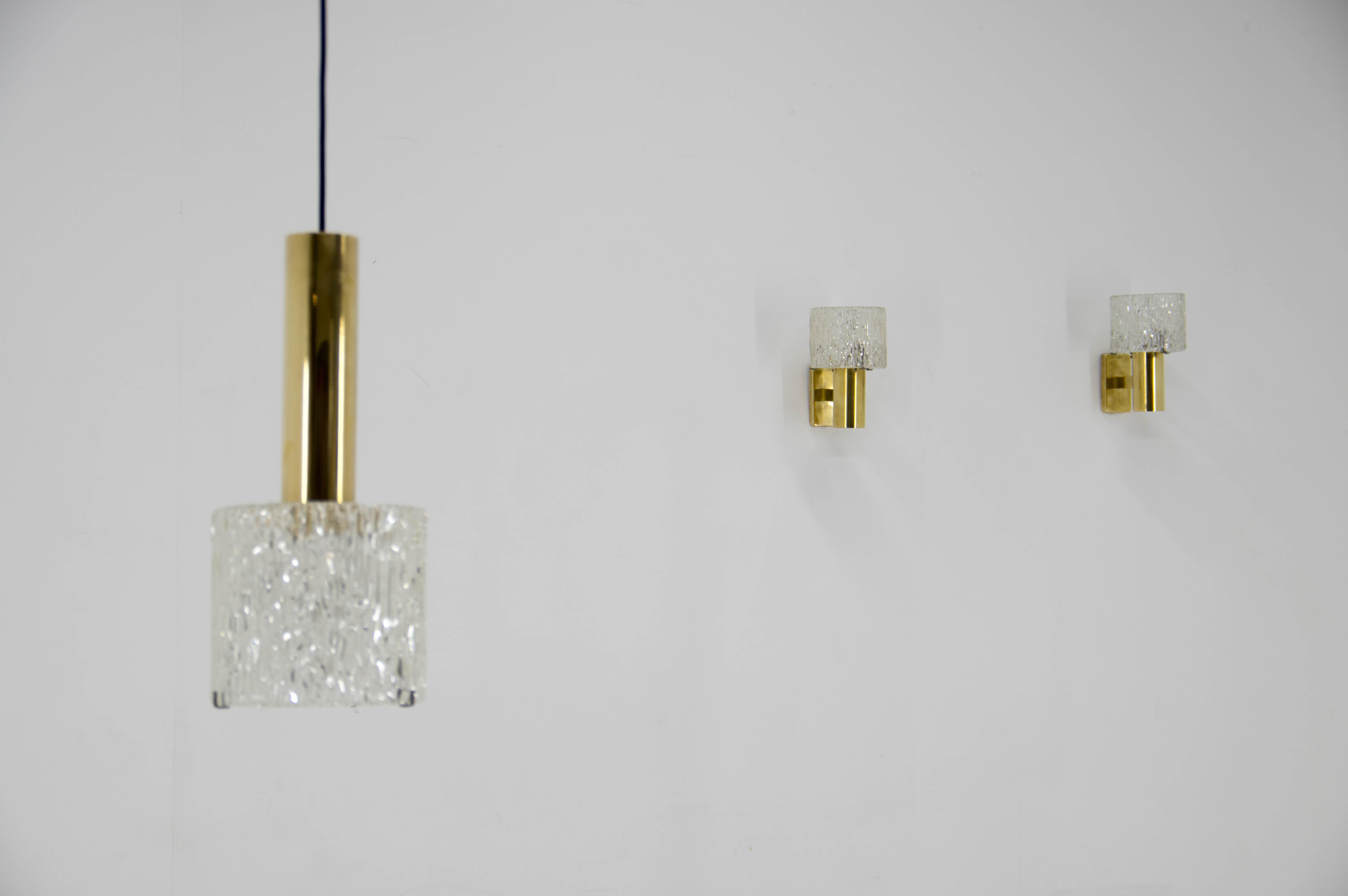 Set of pendant and two wall lamps designed by Carl Fagerlund for Orrefors in late 1950s.
Dimensions of pendant: D: 18cm, H: up to 106cm
Perfect condition, polished, rewired: 40W, E25-E27 bulbs
US wiring compatible

About the designer:
Swedish glass