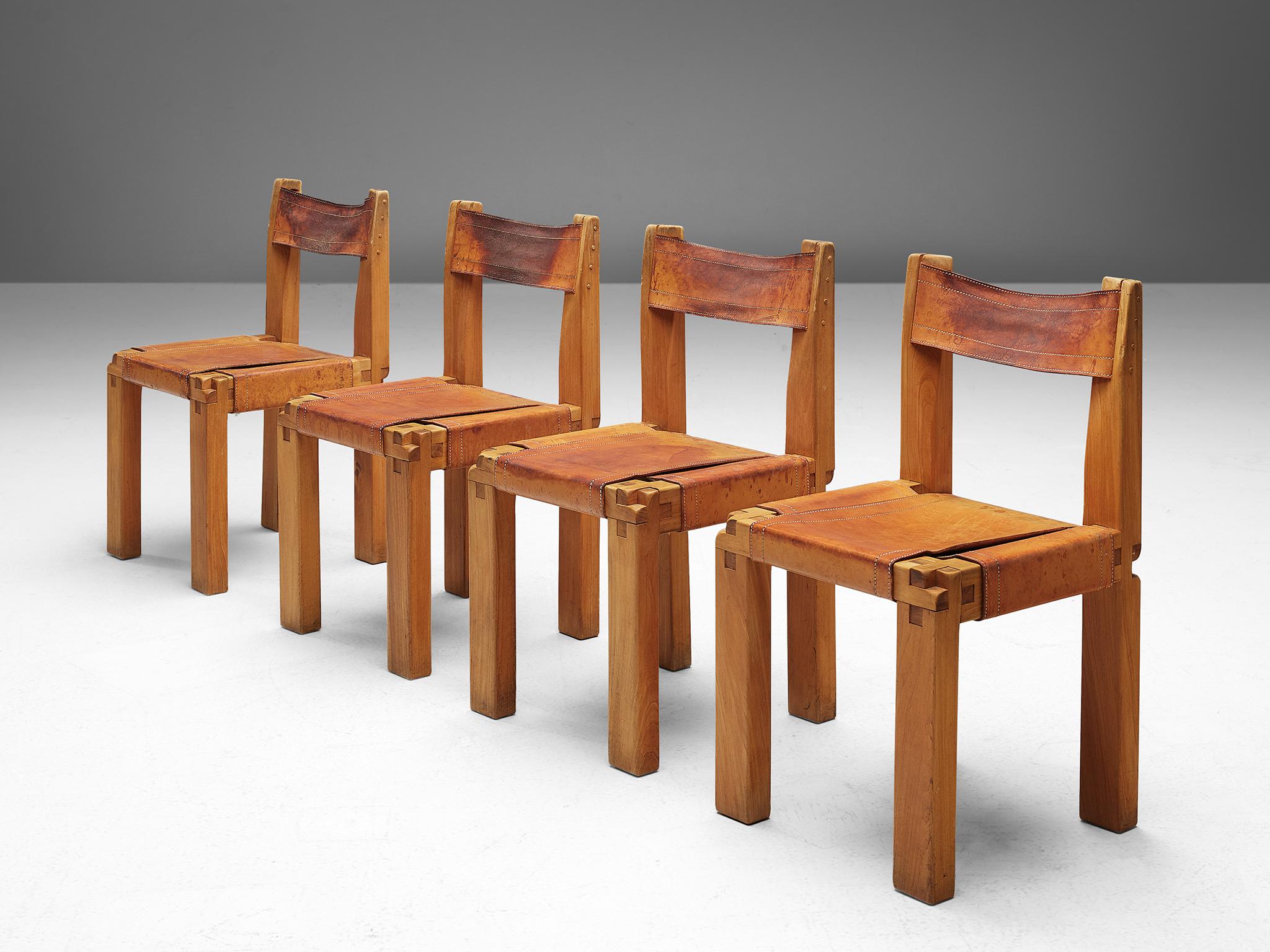 Pierre Chapo, set of four dining chairs, model S11, elm and leather, France, circa 1966. 

A set of four chairs in solid elmwood with black saddle leather seating and back, designed by French designer Pierre Chapo. These chairs have a cubic design
