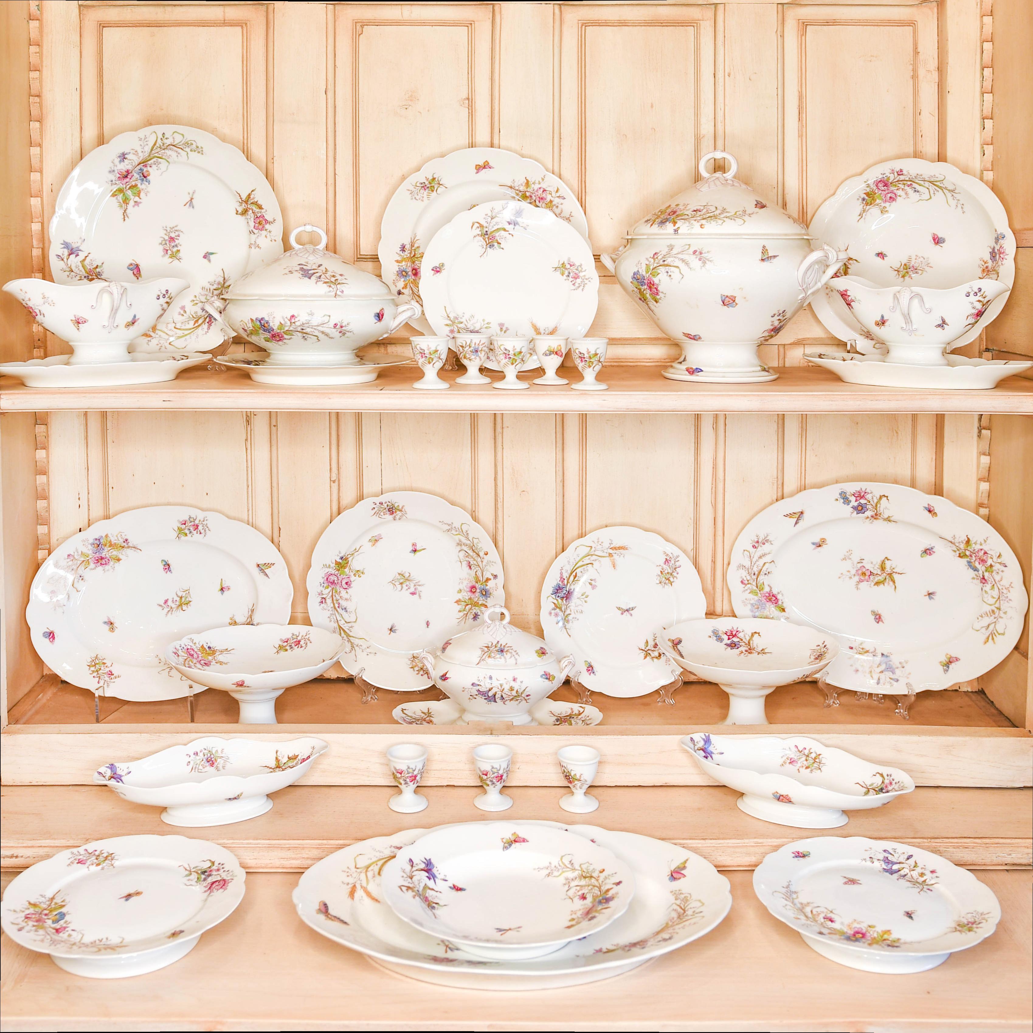 Set consists of: 1 Platter, 38 dinner plates, 8 egg cups, 2 Covered Casseroles, 30 Luncheon Plates, 9 soup bowls, 4 oblong bowls, 2 gravy boats, 1 covered sauce bowl, 2 Pedestal bowls, 4 Pedestal Platters, 3 Oblong Platters, (107