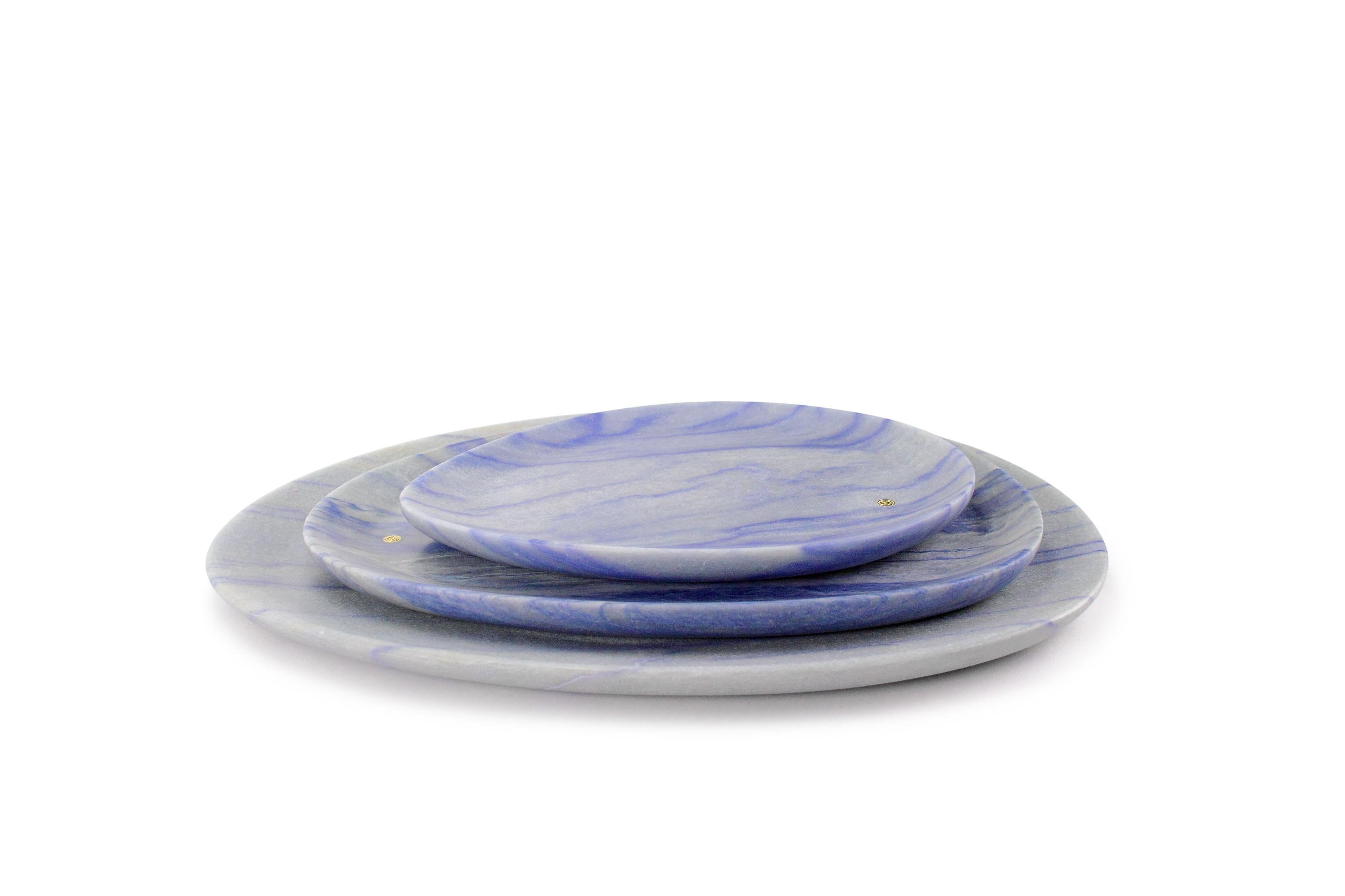 Hand carved presentation plates in semi-precious quartzite Azul Macaubas.
Multiple use as plates, platters and placers. 

Dimensions: Small - L24 W20 H1.8 cm, Medium - L30 W28 H1.8 cm and Big - L36 W35 H1.8 cm.
Available in different marbles, onyx