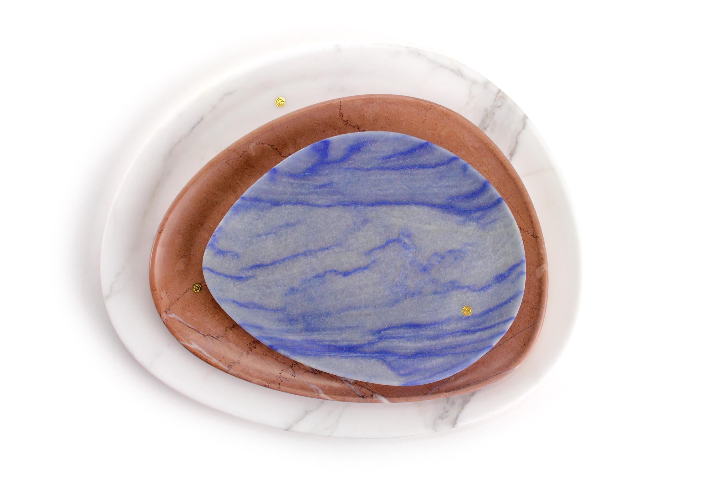 Hand carved presentation plates in Azul Macaubas Quartzite, Pink Assisi stone and Statuary Marble. Multiple use as plates, platters and placers. 

Dimensions: Small - L24 W20 H1.8 cm, Medium - L30 W28 H1.8 cm, Big - L36 W35 H1.8 cm.
Available in