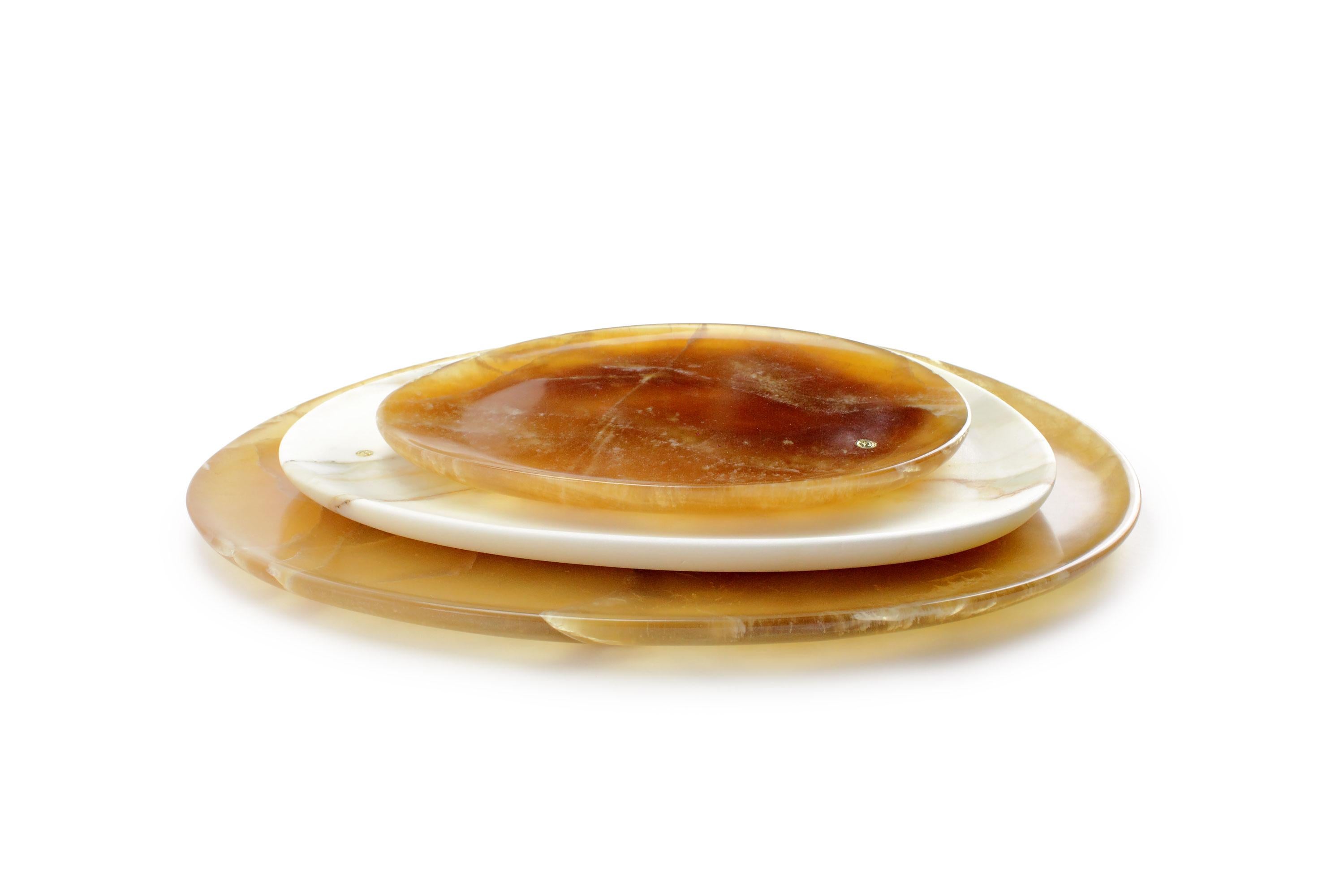 Hand carved presentation plates in Amber onyx and Calacatta marble. Multiple use as plates, platters and placers. 

Dimensions: Small - L 24 W 20 H 1.8 cm, Medium - L 30 W 28 H 1.8 cm, Big - L 36 W 35 H 1.8 cm.
Available in different marbles, onyx