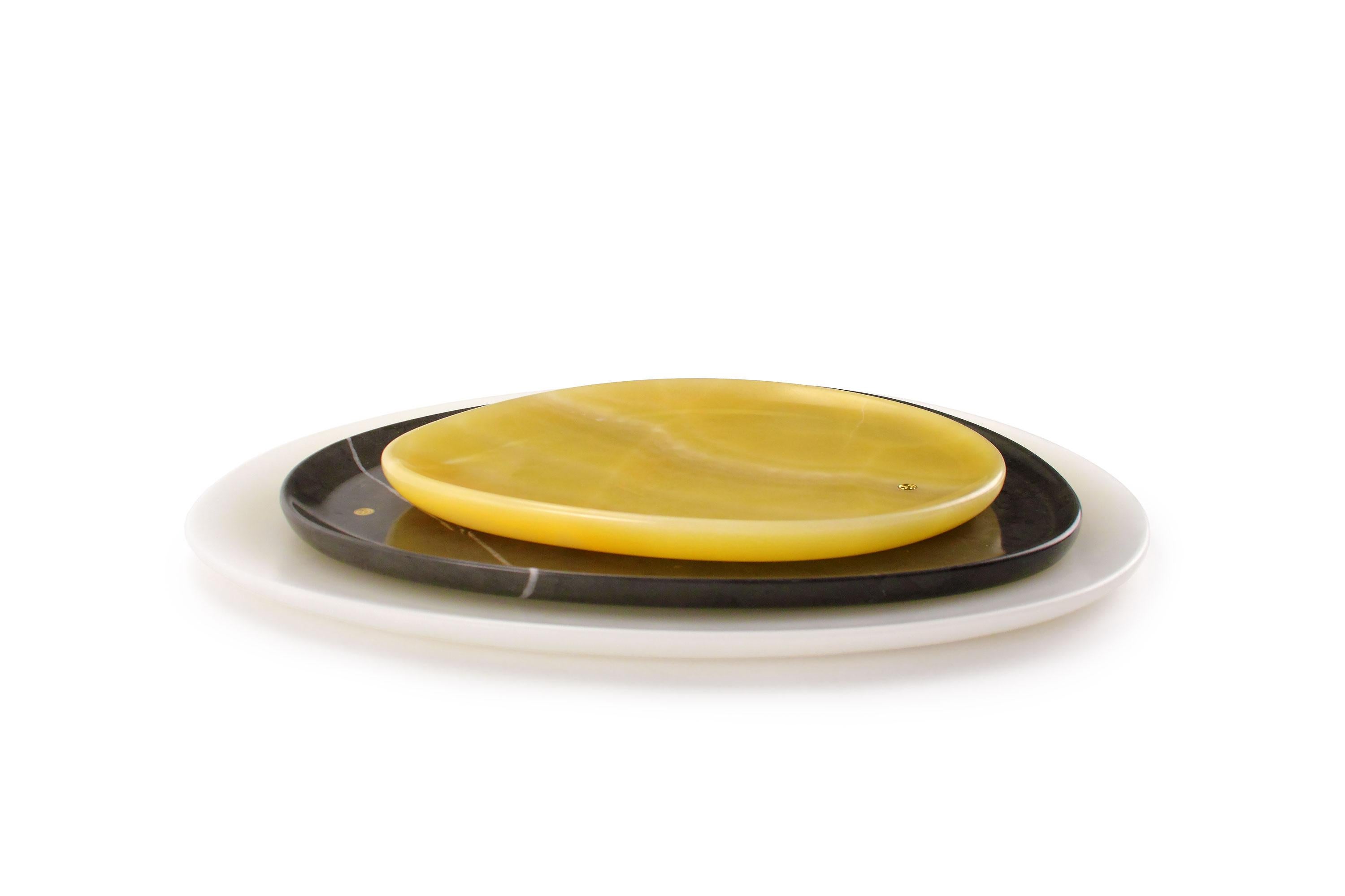 Hand carved presentation plates in Orange onyx, Grey stone and White onyx. Multiple use as plates, platters and placers. 

Dimensions: Small - L24 W20 H1.8 cm, Medium - L30 W28 H1.8 cm, Big - L36 W35 H1.8 cm.
Available in different marbles, onyx and
