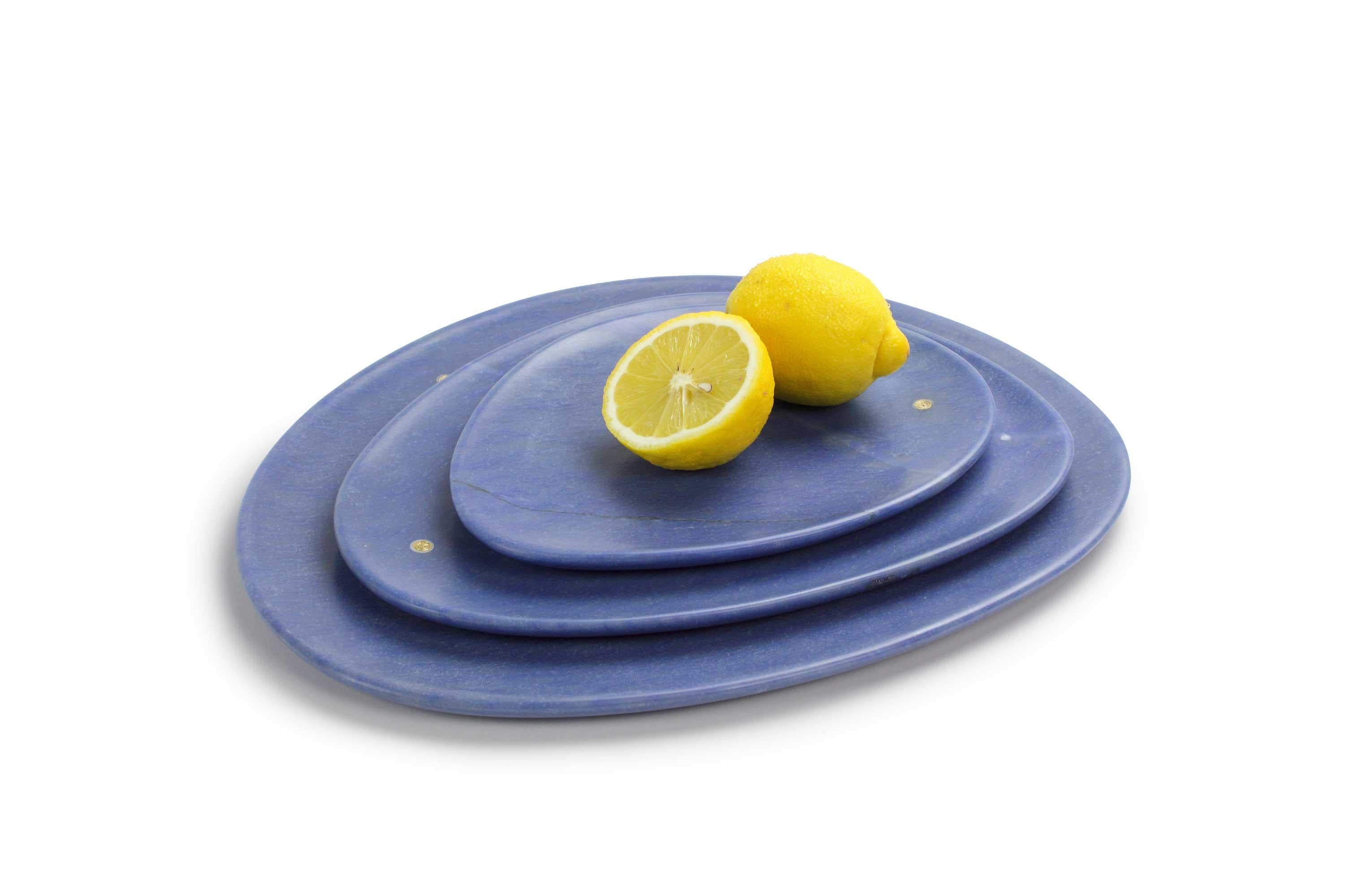Hand carved presentation plates in semi-precious quartzite Azul Macaubas.
Multiple use as plates, platters and placers. 

Dimensions: Small L 24, W 20, H 1.8 cm, medium L 30, W 28, H 1.8 cm and big L 36, W 35, H 1.8 cm.
Available in different
