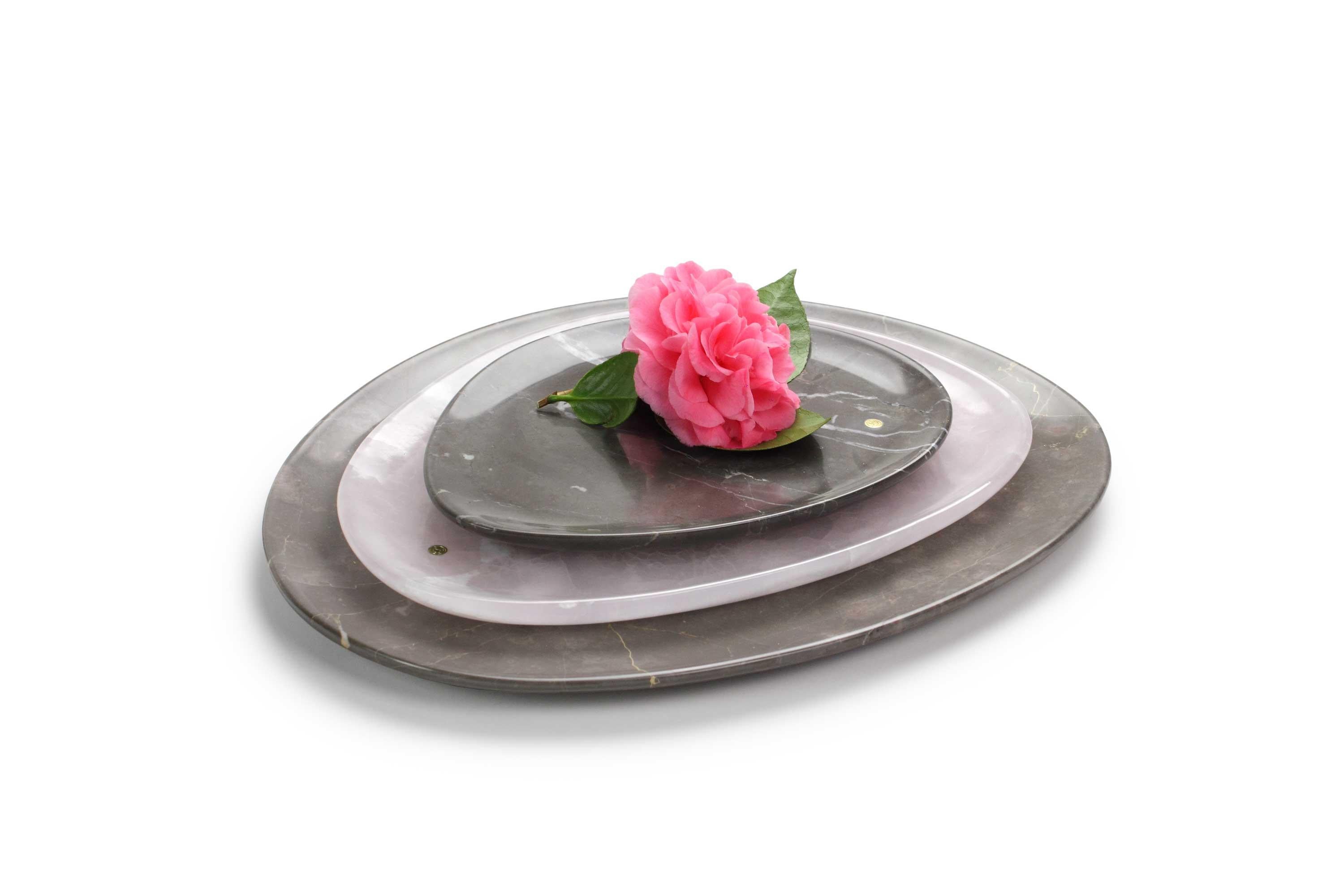 Hand carved presentation plates in Imperial grey marble and pink onyx. 
Multiple use as plates, platters and placers.

Dimensions: Small - L 24 x W 20 x H 1.8 cm, Medium - L 30 x W 28 x H 1.8 cm, Big - L 36 x W 35 H 1.8 cm.
Available in different