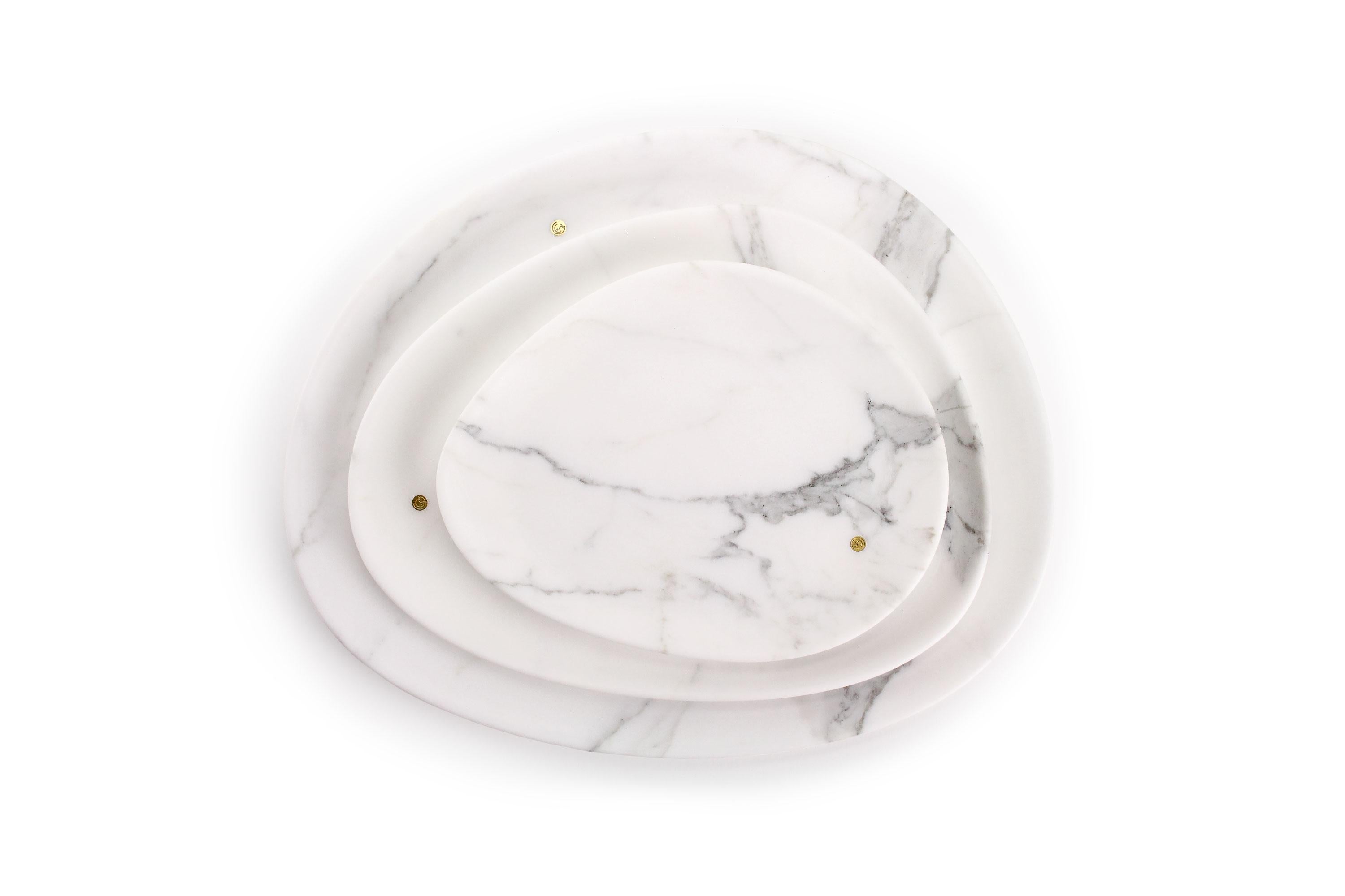 Hand carved presentation plates in Statuary marble. Multiple use as plates, platters and placers. 
The precious white Statuary marble has always been the one preferred by sculptors and artists for their artworks. Known throughout the world, this