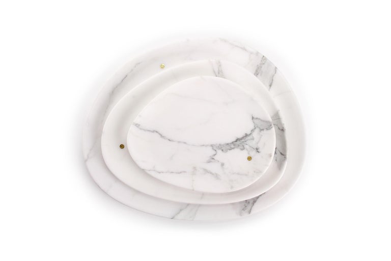 Hand carved presentation plates in Statuary marble. Multiple use as plates, platters and placers. Dimensions: Small - L 24 W 20 H 1.8 cm, Medium - L 30 W 28 H 1.8 cm and Big - L 36 W 35 H 1.8 cm.

The precious white Statuary marble has always been