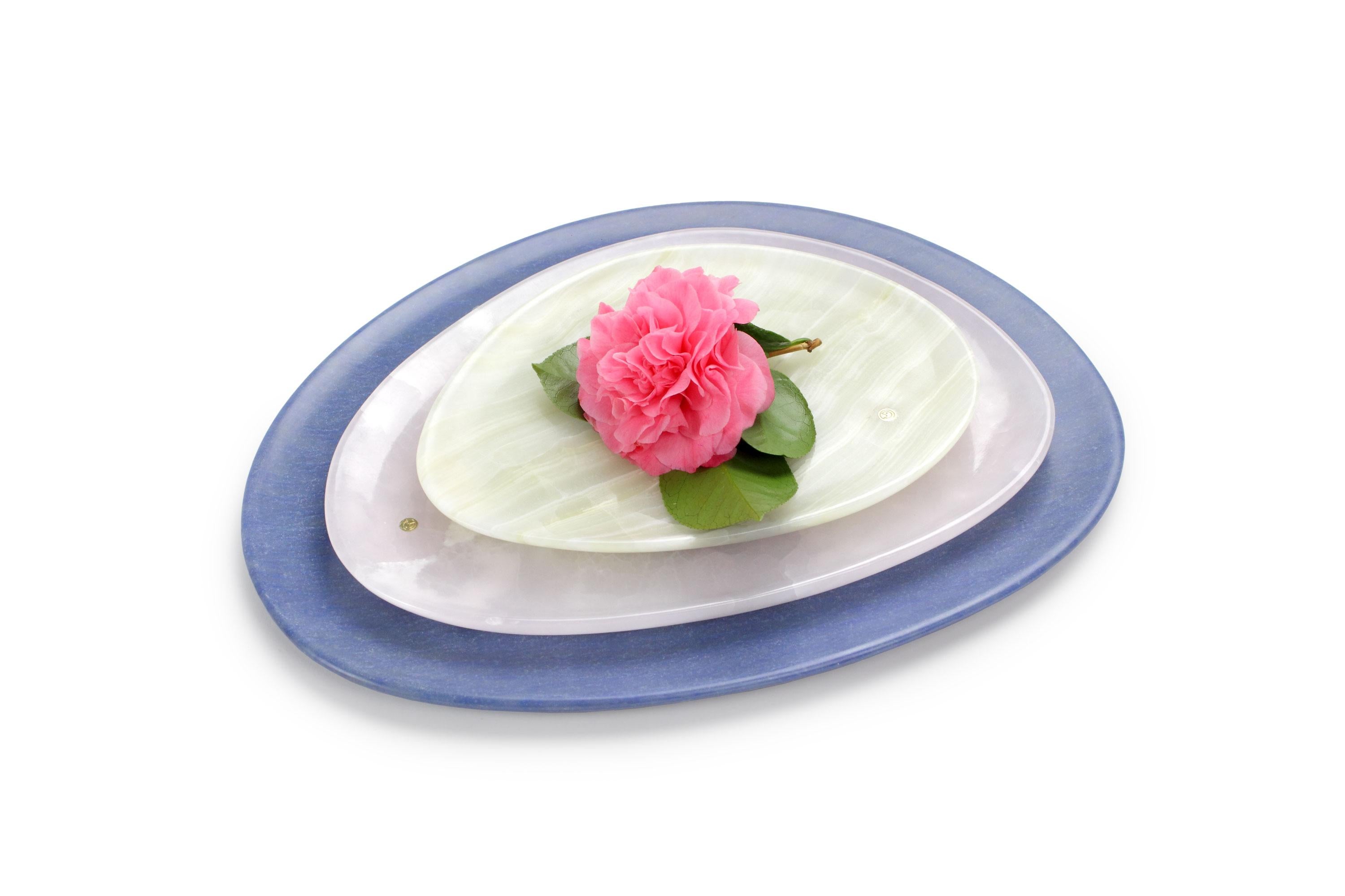 Hand carved presentation plates in green onyx, pink onyx and Azul Macaubas. 
Multiple use as plates, platters and placers. 

Dimensions: Small L 24, W 20, H 1.8 cm, medium L 30, W 28, H 1.8 cm, big L 36, W 35, H 1.8 cm.
Available in different