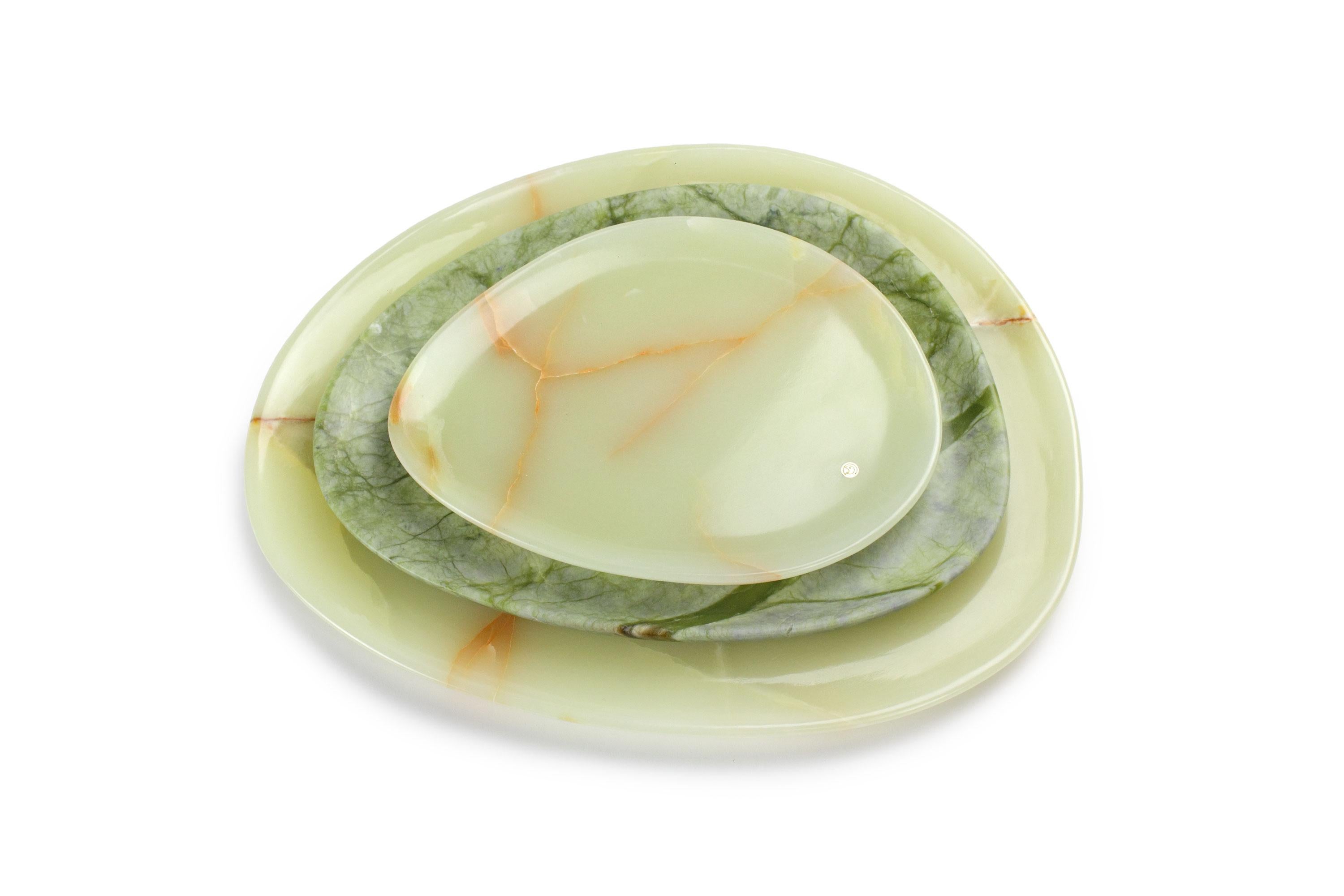 Hand carved presentation plates in green onyx (orange shadows) and Green Ming. 
Multiple use as plates, platters and placers. 

Dimensions: Small - L 24 W 20 H 1.8 cm, Medium - L 30 W 28 H 1.8 cm, Big - L 36 W 35 H 1.8 cm.
Available in different