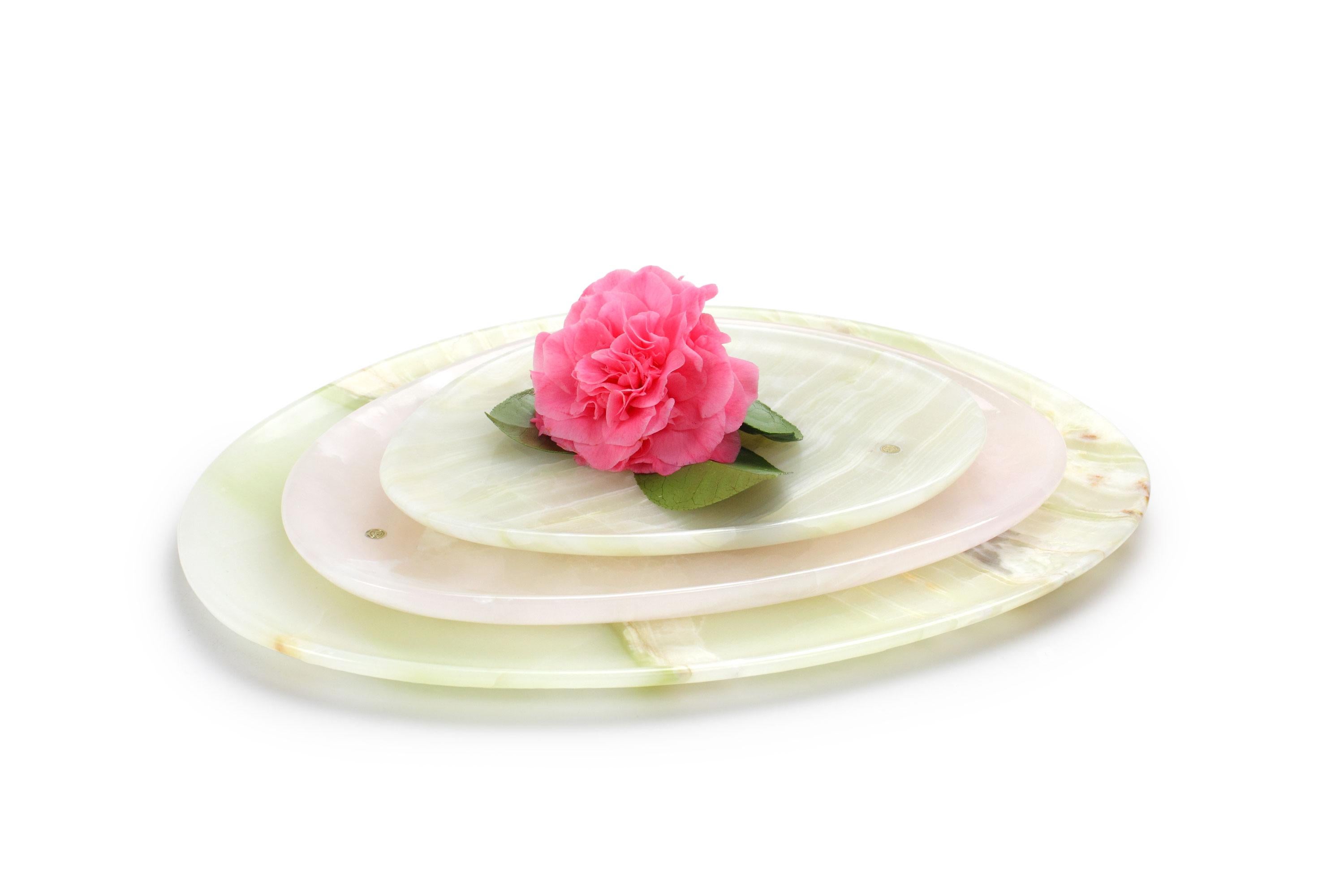 Hand carved presentation plates in green and pink onyx. 
Multiple use as plates, platters and placers. 

Dimensions: Small - L 24 W 20 H 1.8 cm, Medium - L 30 W 28 H 1.8 cm, Big - L 36 W 35 H 1.8 cm.
Available in different marbles, onyx and