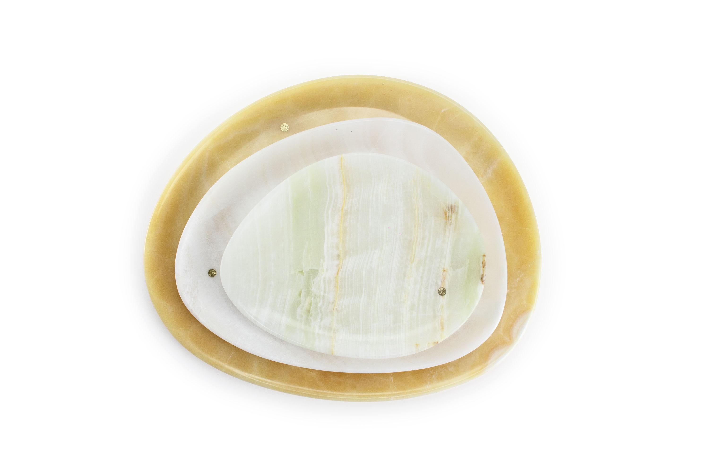 Hand carved presentation plates in green, white and orange onyx . Multiple use as plates, platters and placers. 

Dimensions: Small - L 24 W 20 H 1.8 cm, Medium - L 30 W 28 H 1.8 cm, Big - L 36 W 35 H 1.8 cm.
Available in different marbles, onyx and