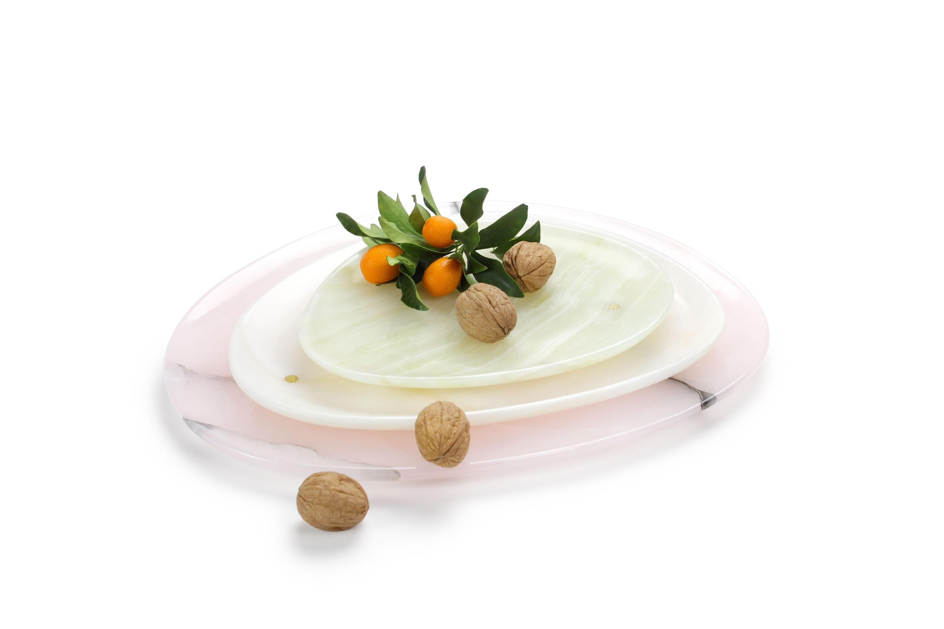 Hand carved presentation plates in green, white and pink onyx. 
Multiple use as plates, platters and placers. 

Dimensions: Small - L24 W20 H1.8 cm, Medium - L30 W28 H1.8 cm, Big - L36 W35 H1.8 cm.
Available in different marbles, onyx and quartzite.