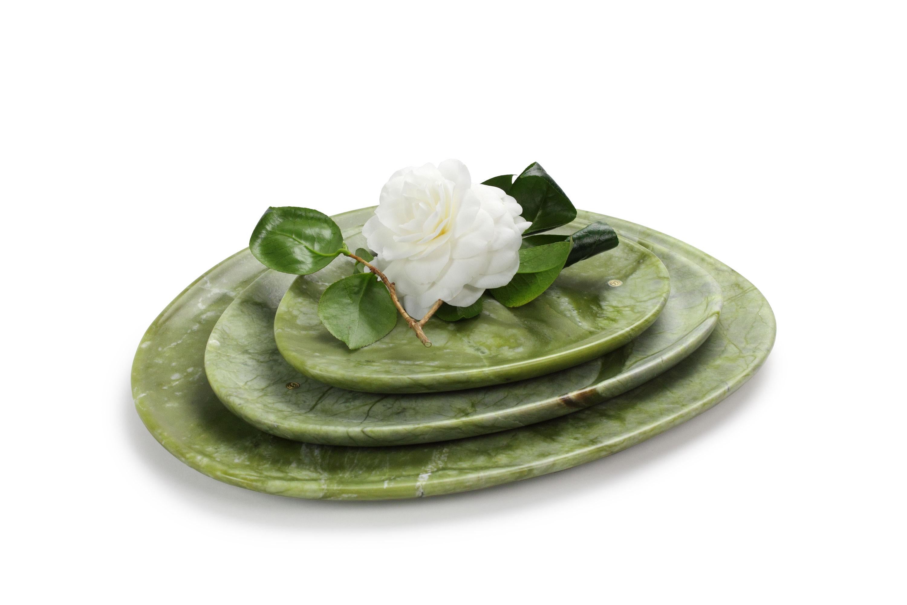 Hand carved presentation plates in Green Ming marble. Multiple use as plates, platters and placers. 

Dimensions: Small L 24, W 20, H 1.8 cm, medium L 30, W 28, H 1.8 cm and big L 36, W 35, H 1.8 cm.
Available in different marbles, onyx and