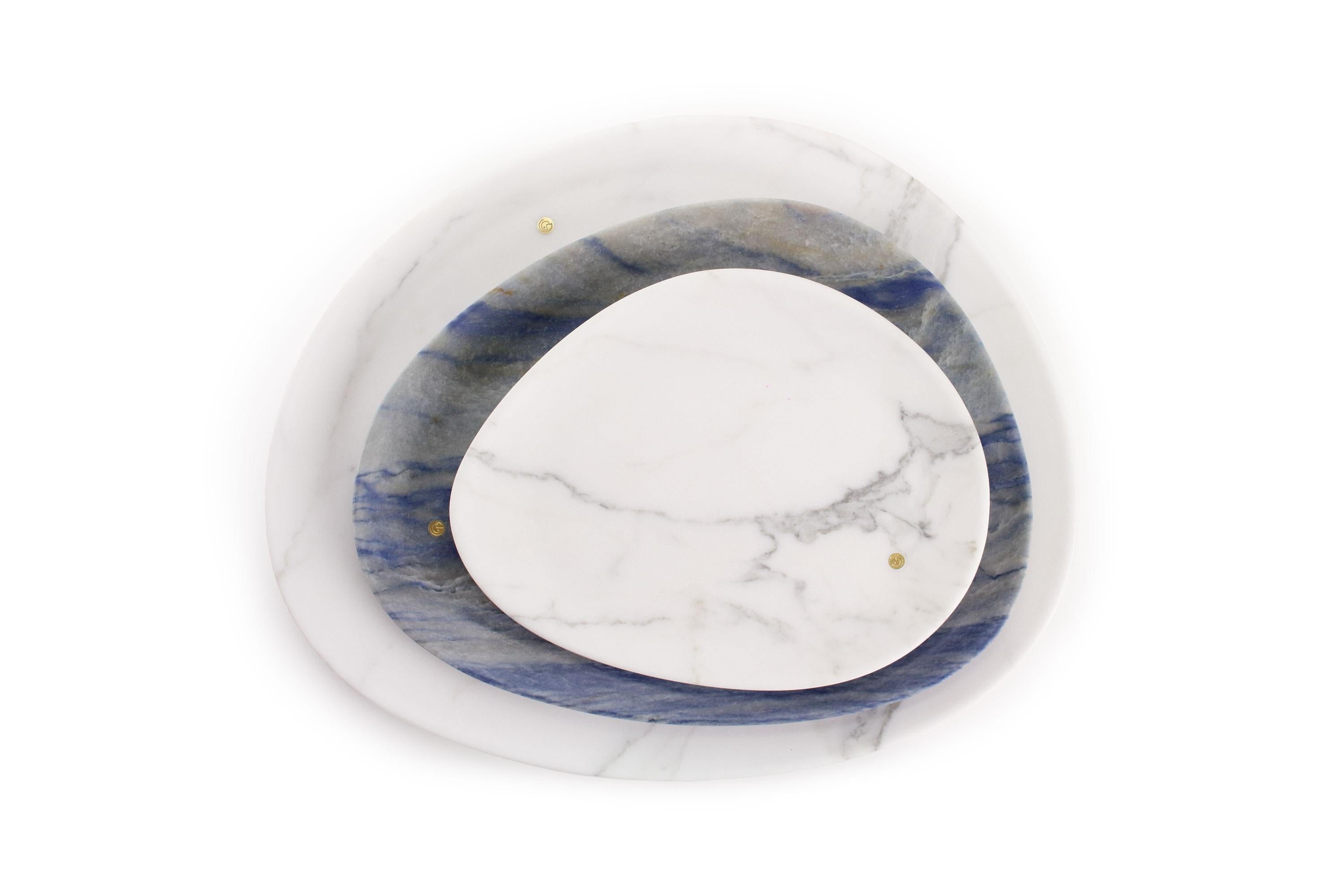 Hand carved presentation plates in Azul Macaubas Quartzite and Statuary marble. 
Multiple use as plates, platters and placers. 

Dimensions: Small - L24 W20 H1.8 cm, Medium - L30 W28 H1.8 cm, Big - L36 W35 H1.8 cm.
Available in different marbles,