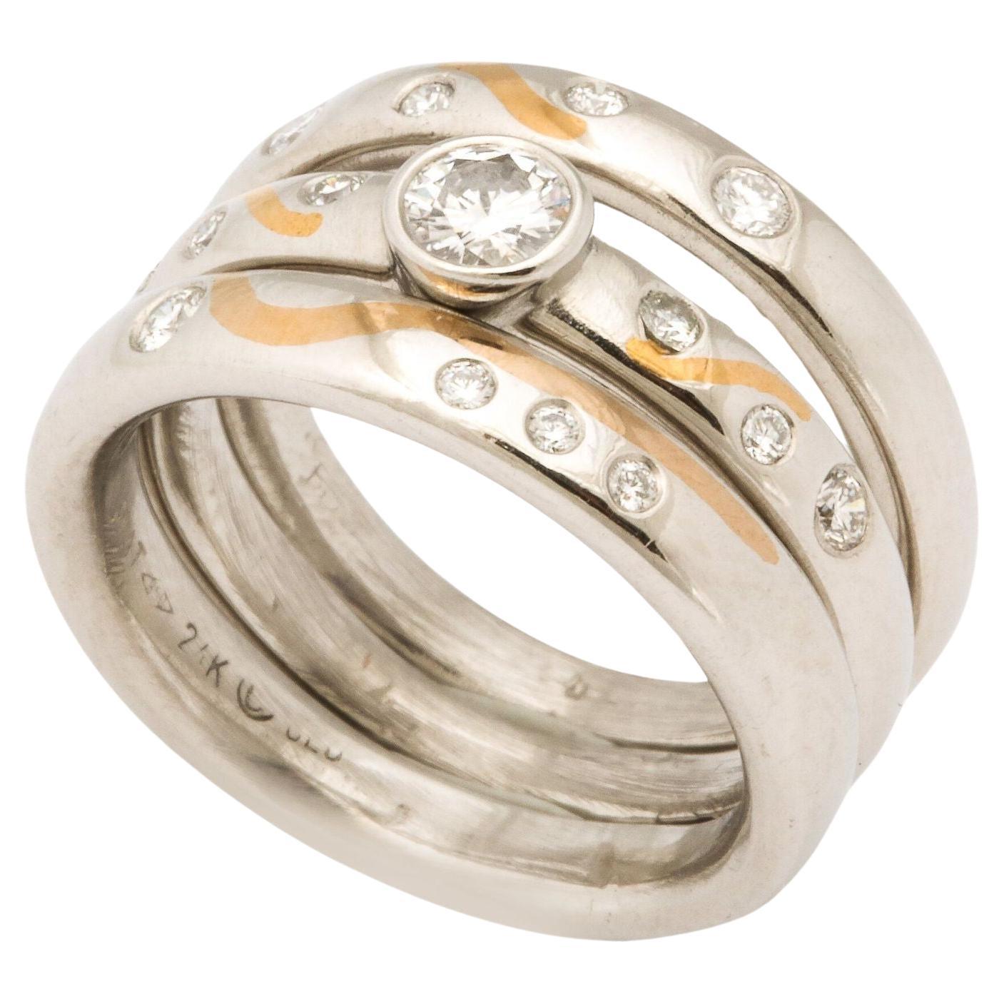 Set of Platinum Stacking Bands with Diamonds and Inlaid Gold For Sale