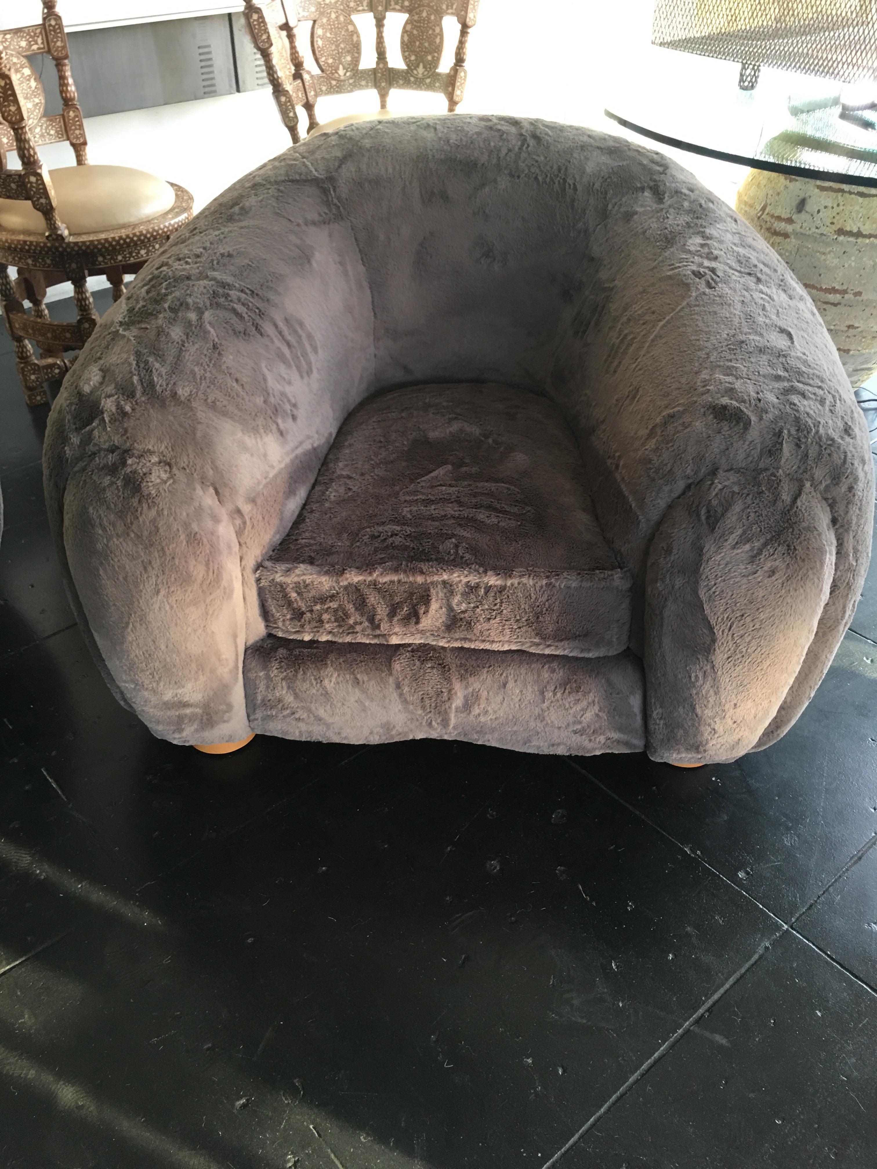 Most beautiful set of Polar Bear sofa and chairs, upholstered in charcoal color shearling fabric, edition 1970s. Can be purchased as a set or individual pieces.
The sofa measures 34” H x 93” W x 48” D
The chairs measure 30” H x 48” W x 44” D.