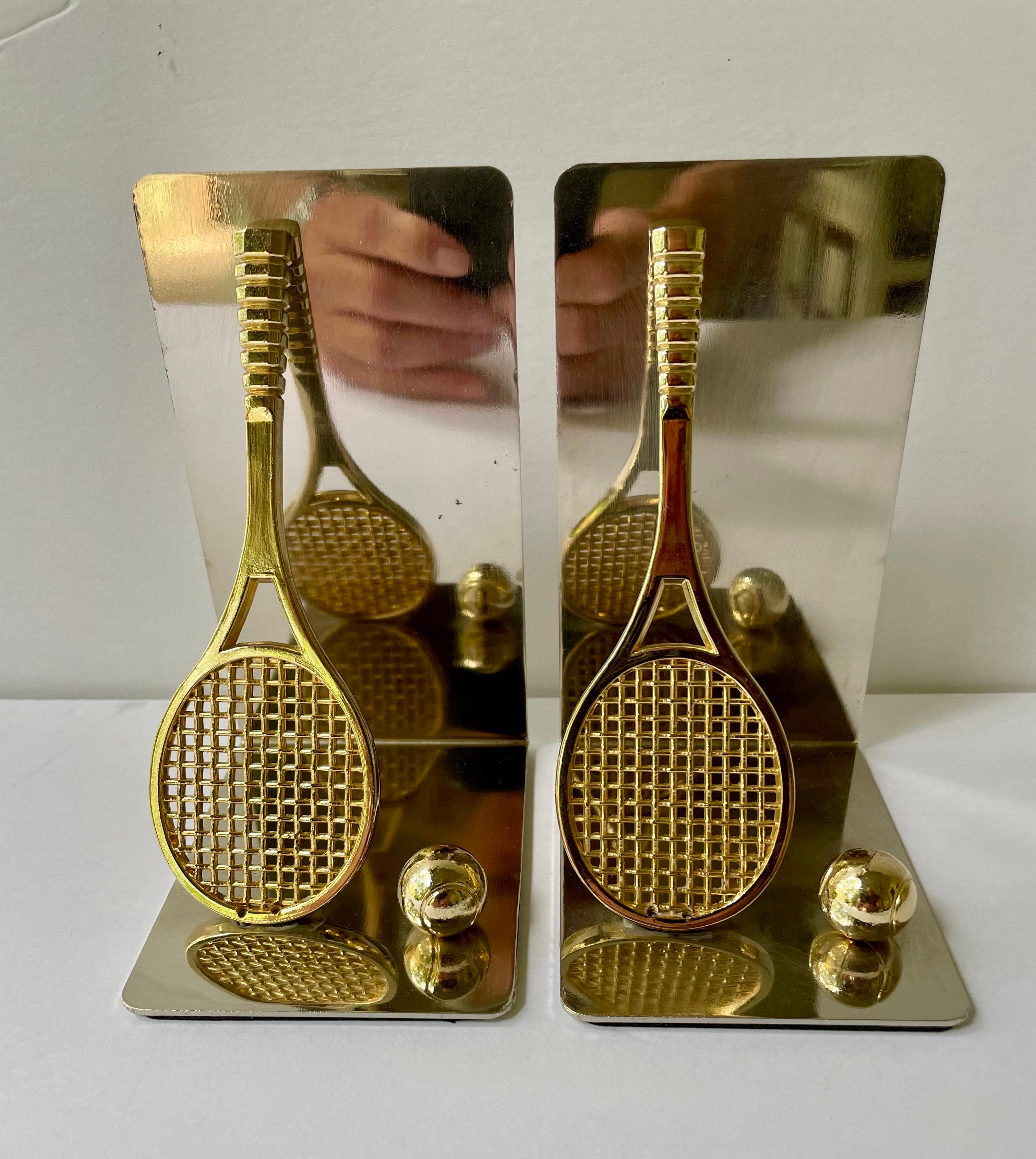 Set of brass and chrome tennis racket bookends. Has thin foam on bottom to prevent scratching furniture. 5