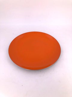 Set of Polished Stainless Steel and Orange Enamel Plates by Catherine Holm