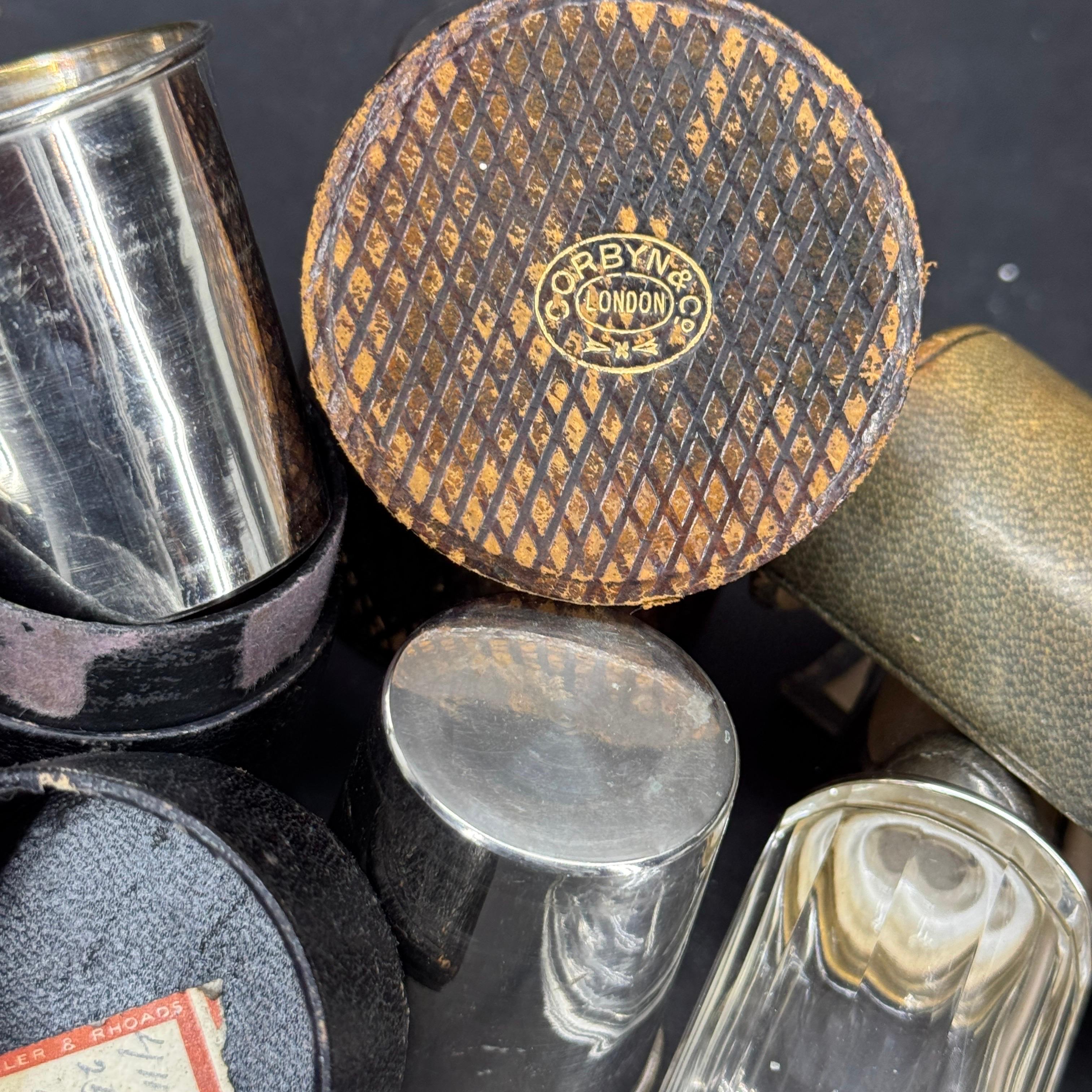 This set of three portable shot glasses and flask come with their original etui leather box covers. One has been stamped Corbyn & Co. London. The primary purpose of these antique encased pieces was to provide a portable and convenient way to carry