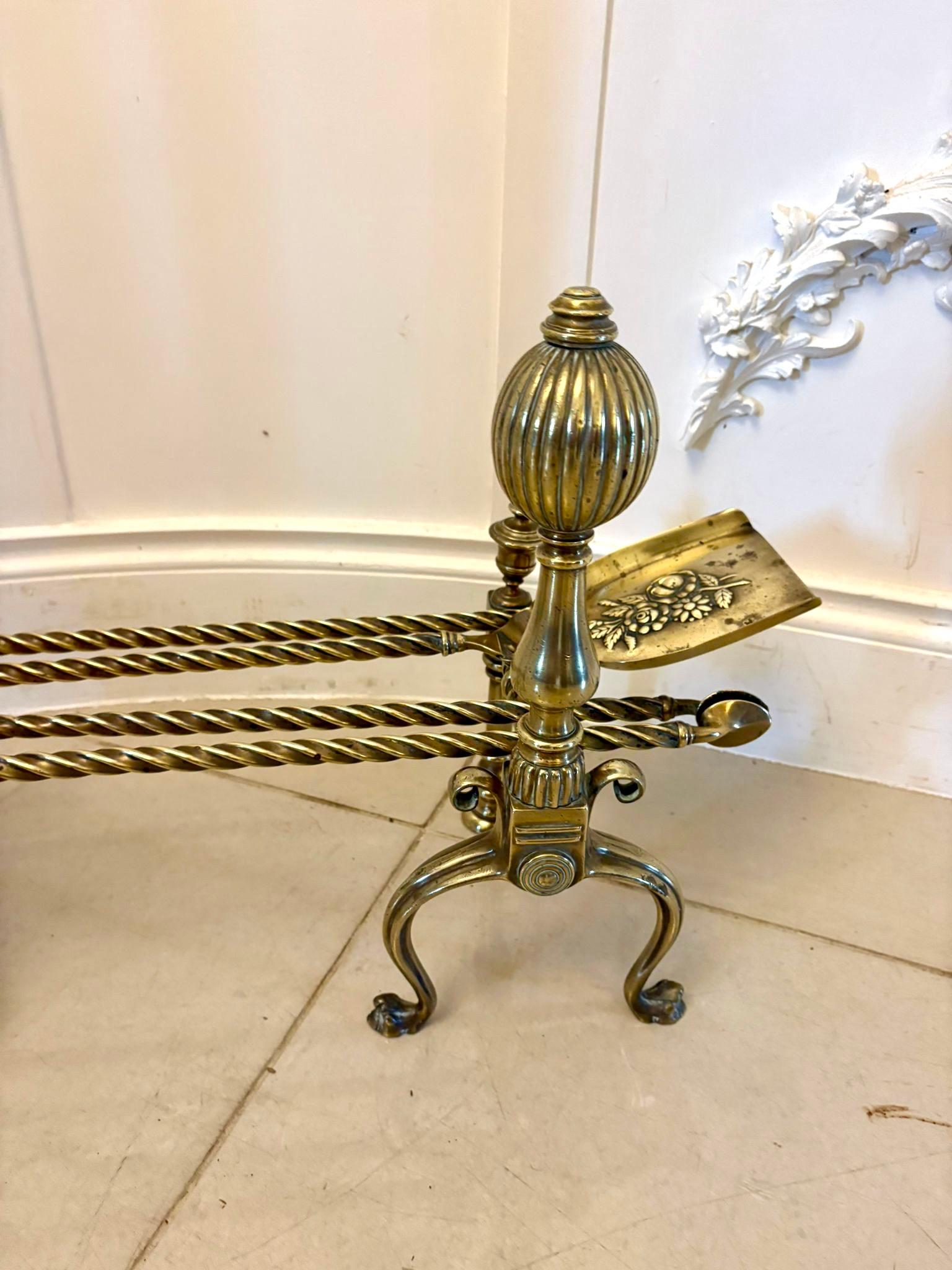 Set of quality antique Victorian brass fire irons and dogs having a pair of quality brass fire dogs with matching fire irons consisting of a poker, shovel and fire tongs with rope twist decoration.

We can offer our own very competitive
