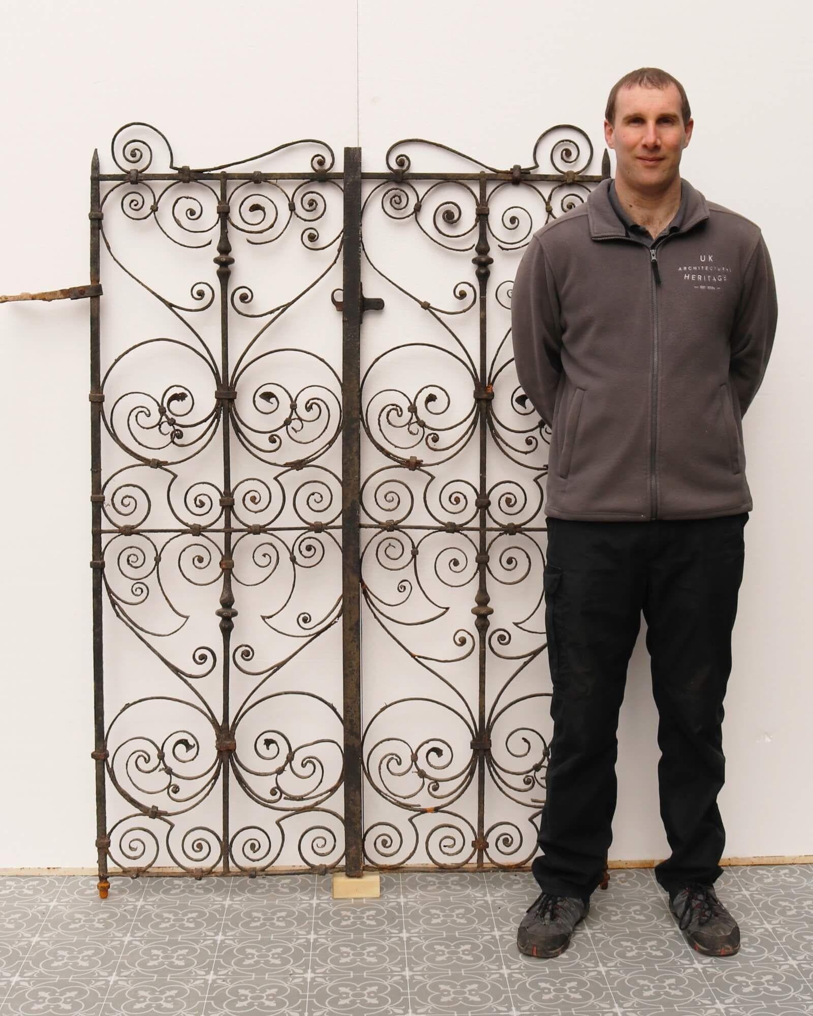 An intricately detailed, rare set of Georgian wrought iron pedestrian gates circa 1780. Stepped in history, these antique gates make an impressive entrance to a period country garden, crafted with an abundance of beautiful scrolls. Made at the hand